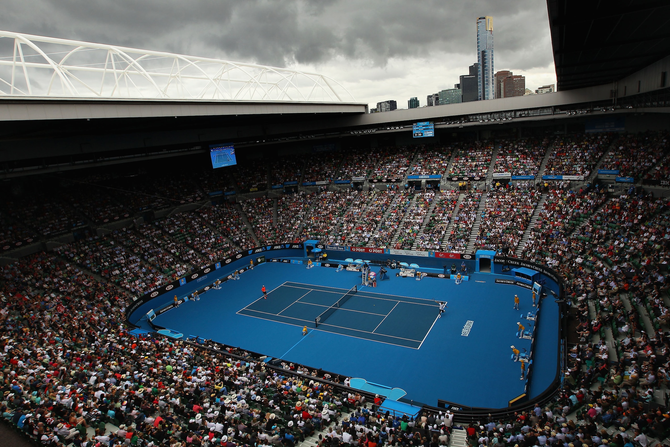 MELBOURNE, AUSTRALIA - JANUARY 17: Rain clouds are seen over the Rod Laver Arena as Roger Federer of Switzerland plays in his first round match against Lukas Lacko of Slovakia during day one of the 2011 Australian Open at Melbourne Park on January 17, 20 MELBOURNE, AUSTRALIA - JANUARY 17: Rain clouds are seen over the Rod Laver Arena as Roger Federer of Switzerland plays in his first round match against Lukas Lacko of Slovakia during day one of the 2011 Australian Open at Melbourne Park on January 17, 20