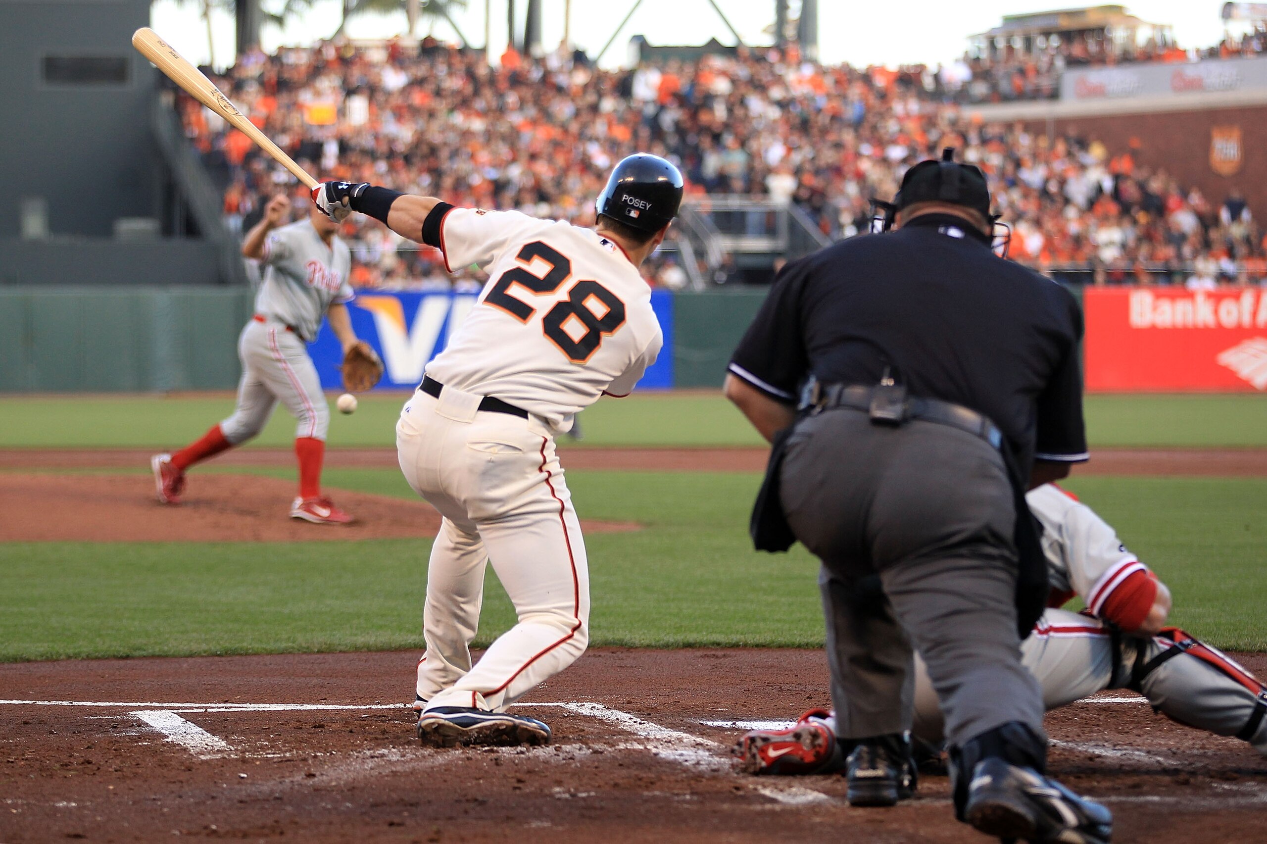 SAN FRANCISCO - OCTOBER 20:  Buster Posey #28 of the San Francisco Giants hits an RBI single off Joe Blanton #56 in the first inning of Game Four of the NLCS during the 2010 MLB Playoffs at AT&T Park on October 20, 2010 in San Francisco, California.  (Pho