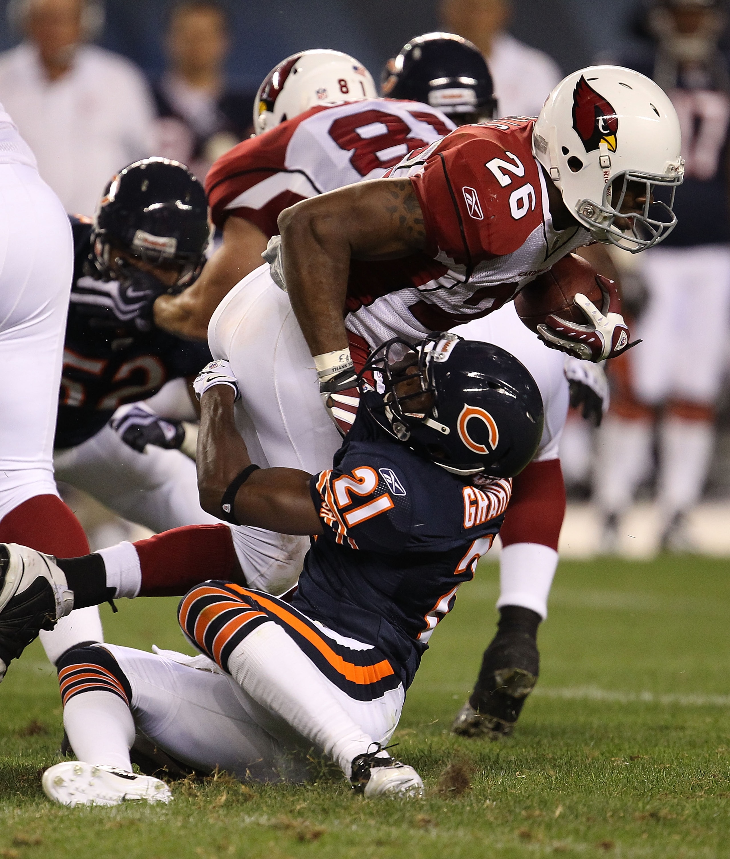 CHICAGO - AUGUST 28: Corey Graham #21 of the Chicago Bears drops Beanie Wells #26 of the Arizona Cardinals during a preseason game at Soldier Field on August 28, 2010 in Chicago, Illinois. The Cardinals defeated the Bears 14-9. (Photo by Jonathan Daniel/G