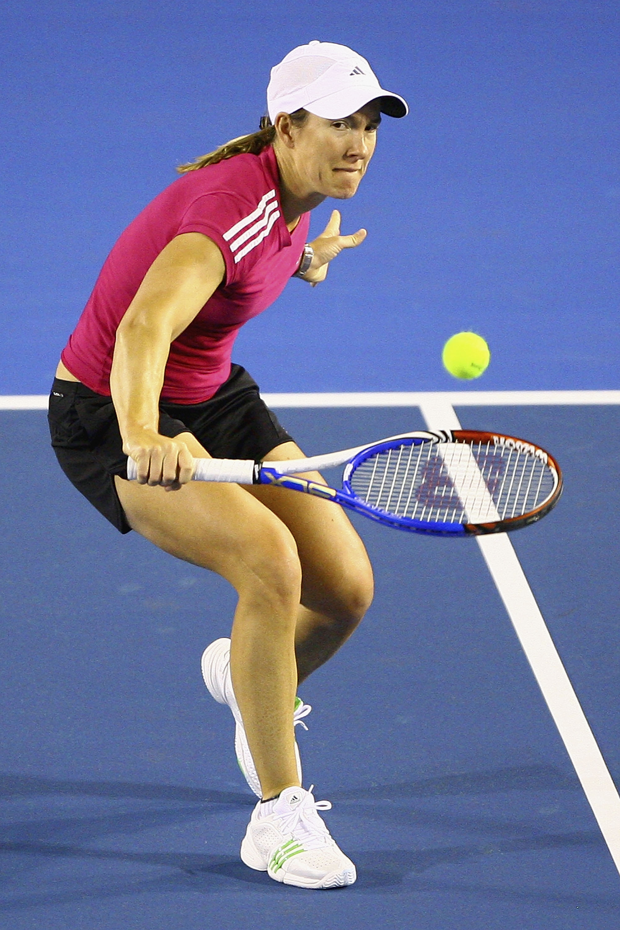 MELBOURNE, AUSTRALIA - JANUARY 10:  Justine Henin of Belgium plays a backhand during a practice session ahead of the 2011 Australian Open at Melbourne Park on January 10, 2011 in Melbourne, Australia.  (Photo by Robert Prezioso/Getty Images)