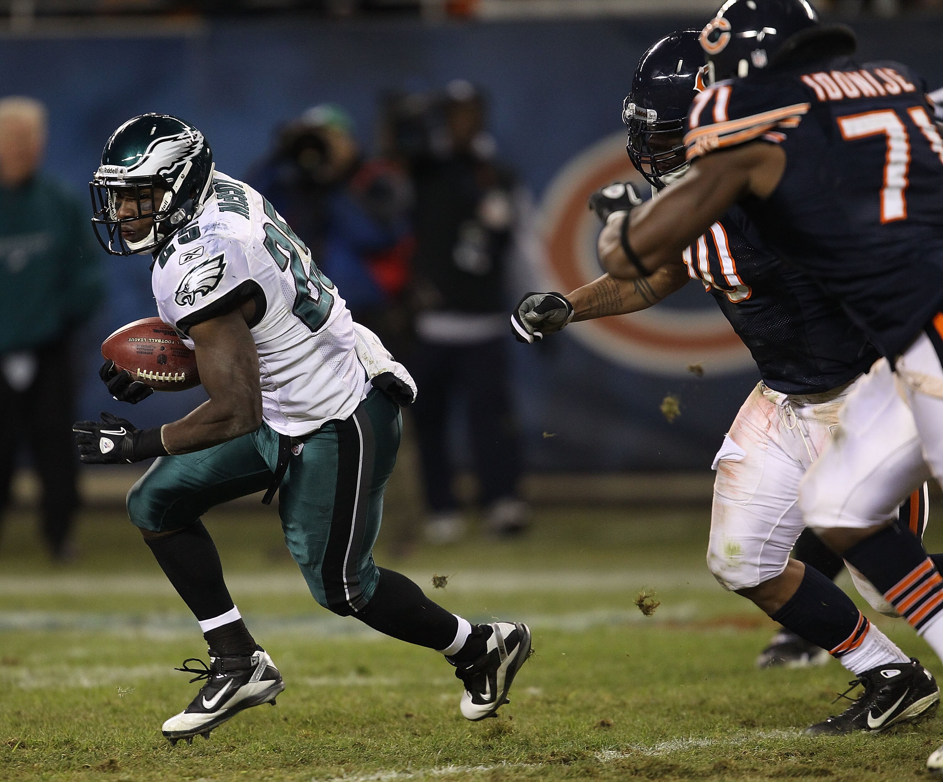 CHICAGO - NOVEMBER 28: LeSean McCoy #25 of the Philadelphia Eagles tries to escape Julius Peppers #90 and Israel Idonije #71 of the Chicago Bears at Soldier Field on November 28, 2010 in Chicago, Illinois. The Bears defeated the Eagles 31-26. (Photo by Jo