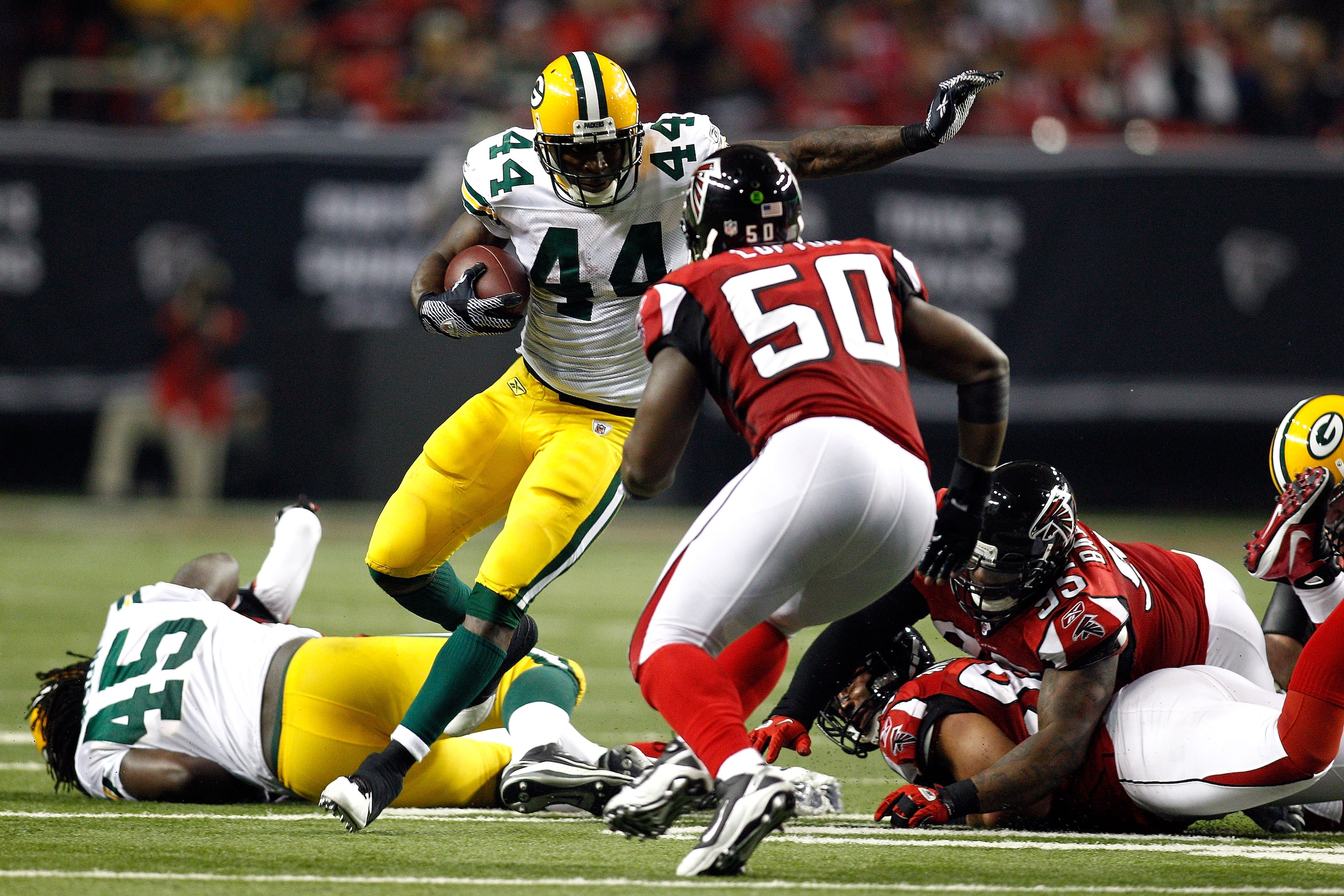ATLANTA, GA - JANUARY 15: James Starks #44 of the Green Bay Packers runs the ball against Curtis Lofton #50 of the Atlanta Falcons during their 2011 NFC divisional playoff game at Georgia Dome on January 15, 2011 in Atlanta, Georgia. (Photo by Chris Gra ATLANTA, GA - JANUARY 15: James Starks #44 of the Green Bay Packers runs the ball against Curtis Lofton #50 of the Atlanta Falcons during their 2011 NFC divisional playoff game at Georgia Dome on January 15, 2011 in Atlanta, Georgia. (Photo by Chris Gra