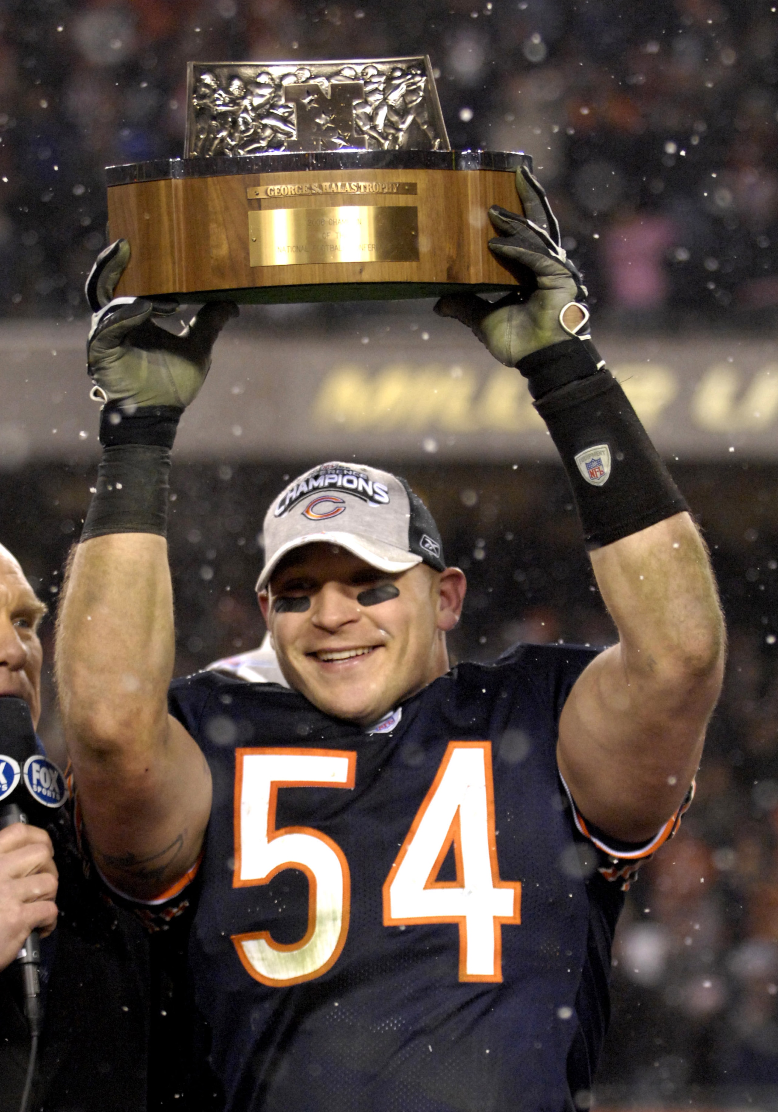 Chicago Bears linebacker Brian Urlacher holds the George Halas trophy after play against the New Orleans Saints at the NFC Championship game at Soldier Field in Chicago, Illinois on January 21, 2007. (Photo by Al Messerschmidt/Getty Images) Chicago Bears linebacker Brian Urlacher holds the George Halas trophy after play against the New Orleans Saints at the NFC Championship game at Soldier Field in Chicago, Illinois on January 21, 2007. (Photo by Al Messerschmidt/Getty Images)
