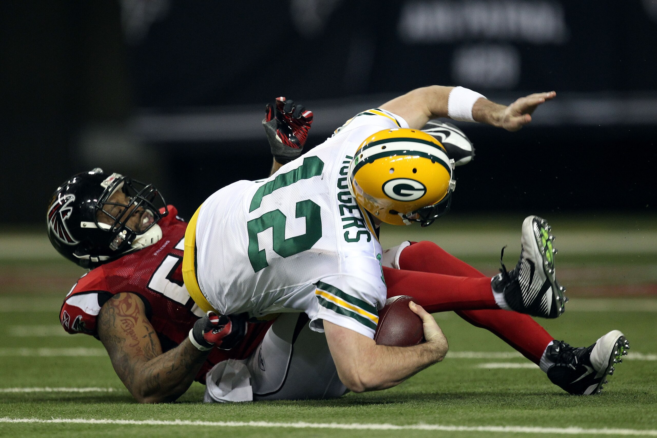 ATLANTA, GA - JANUARY 15: John Abraham #55 of the Atlanta Falcons sacks Aaron Rodgers #12 of the Green Bay Packers during their 2011 NFC divisional playoff game at Georgia Dome on January 15, 2011 in Atlanta, Georgia. (Photo by Streeter Lecka/Getty Imag ATLANTA, GA - JANUARY 15: John Abraham #55 of the Atlanta Falcons sacks Aaron Rodgers #12 of the Green Bay Packers during their 2011 NFC divisional playoff game at Georgia Dome on January 15, 2011 in Atlanta, Georgia. (Photo by Streeter Lecka/Getty Imag