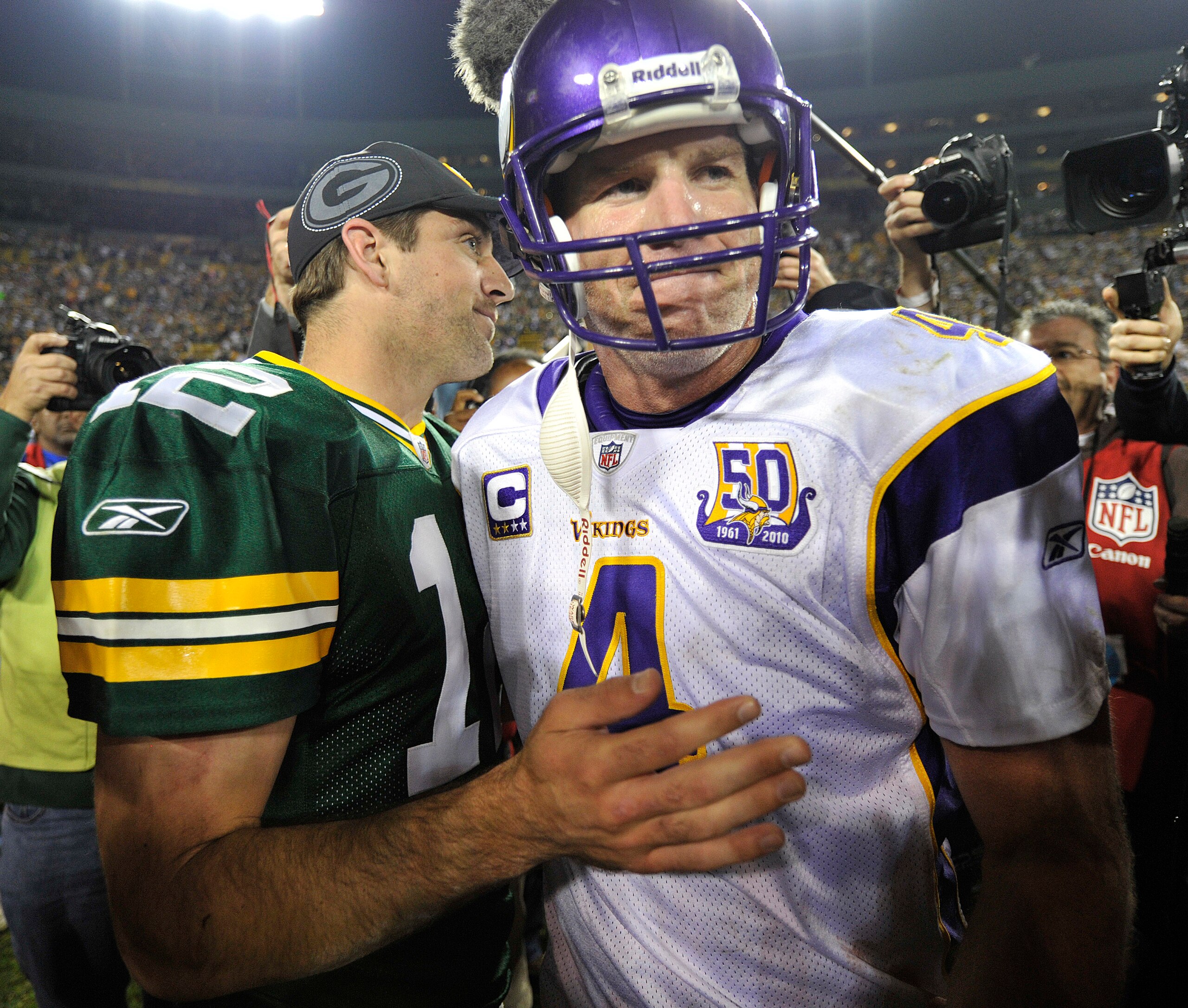 GREEN BAY, WI - OCTOBER 24: Aaron Rodgers #12 of the Green Bay Packers meets with Brett Favre #4 of the Minnesota Vikings after the Packers defeated the Vikings 28-24 at Lambeau Field on October 24, 2010 in Green Bay, Wisconsin. (Photo by Jim Prisching/Ge GREEN BAY, WI - OCTOBER 24: Aaron Rodgers #12 of the Green Bay Packers meets with Brett Favre #4 of the Minnesota Vikings after the Packers defeated the Vikings 28-24 at Lambeau Field on October 24, 2010 in Green Bay, Wisconsin. (Photo by Jim Prisching/Ge