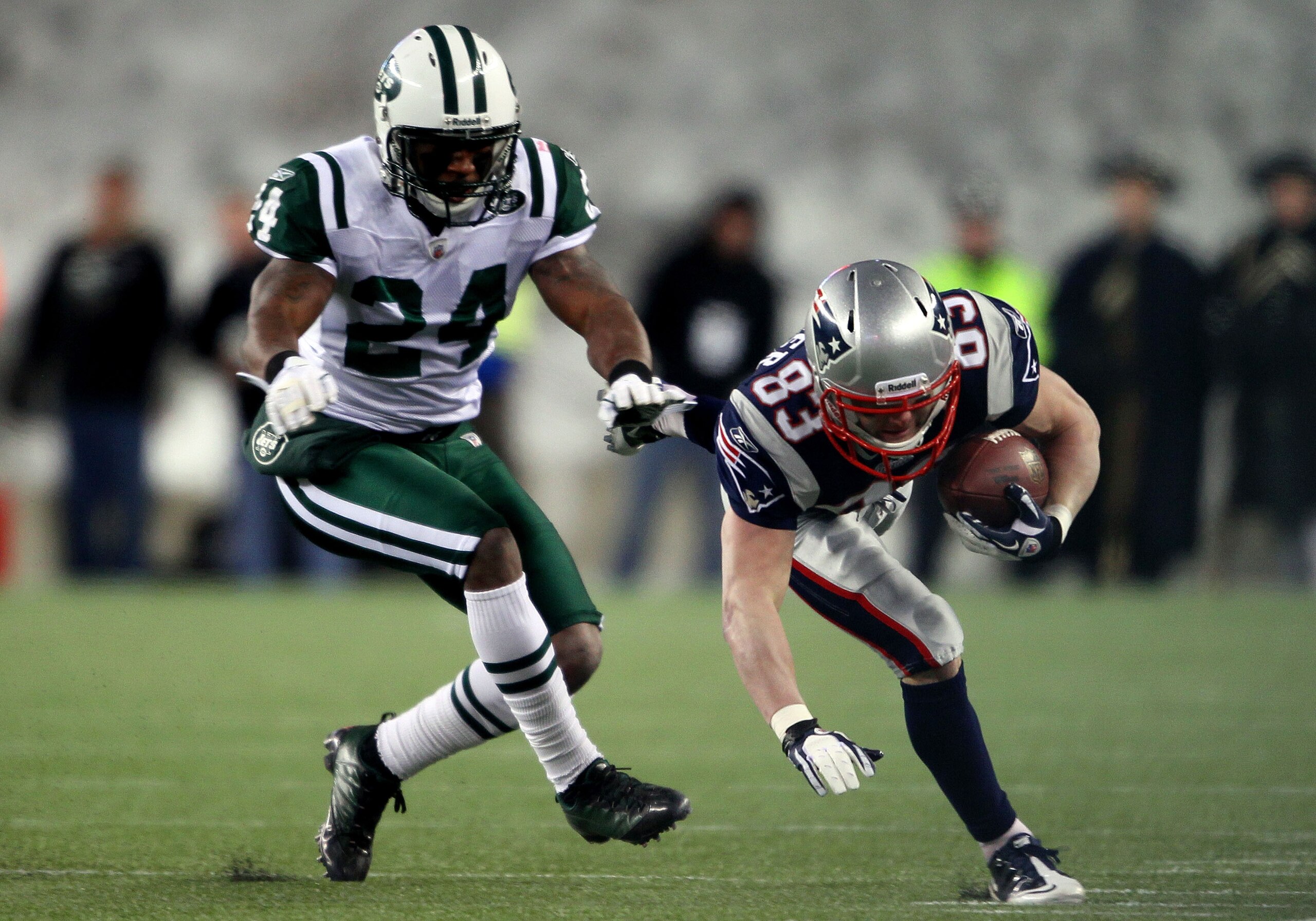 FOXBORO, MA - JANUARY 16: Wes Welker #83 of the New England Patriots runs down field against the defense of Darrelle Revis #24 of the New York Jets during their 2011 AFC divisional playoff game at Gillette Stadium on January 16, 2011 in Foxboro, Massachu FOXBORO, MA - JANUARY 16: Wes Welker #83 of the New England Patriots runs down field against the defense of Darrelle Revis #24 of the New York Jets during their 2011 AFC divisional playoff game at Gillette Stadium on January 16, 2011 in Foxboro, Massachu