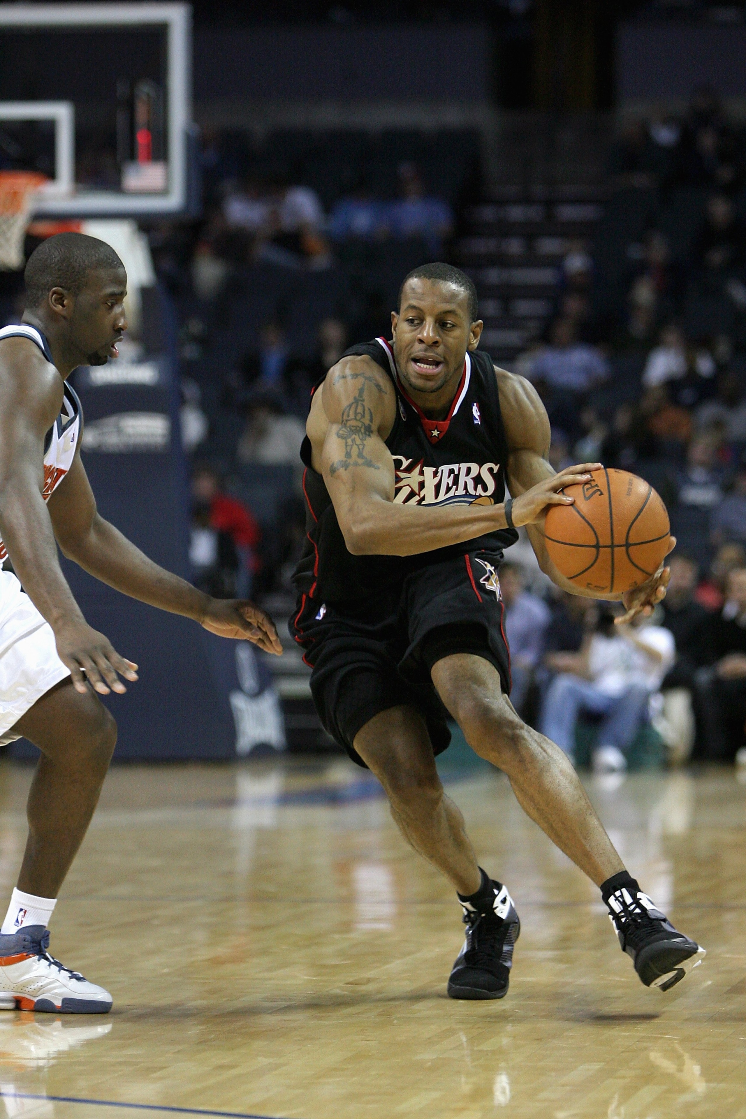 CHARLOTTE, NC - NOVEMBER 24:  Andre Iguodala #9 of the Philadelphia 76ers drives against Raymond Felton #20 of the Charlotte Bobcats during the game on November 24, 2008 at Charlotte Bobcats Arena in Charlotte, North Carolina.  The Bobcats won 93-84.  NOT