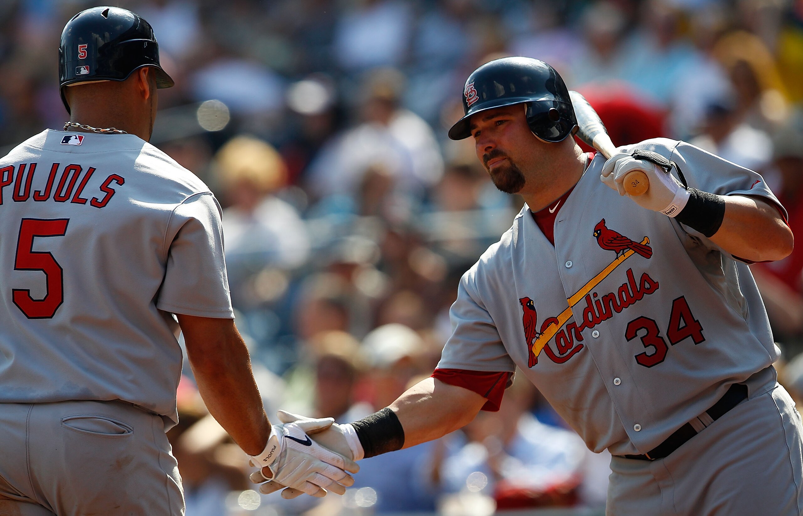 PITTSBURGH - SEPTEMBER 23:  Albert Pujols #5 of the St Louis Cardinals is congratulated by teammate Nick Stavinoha #34 after hitting his second home run of the game against the Pittsburgh Pirates during the game on September 23, 2010 at PNC Park in Pittsb