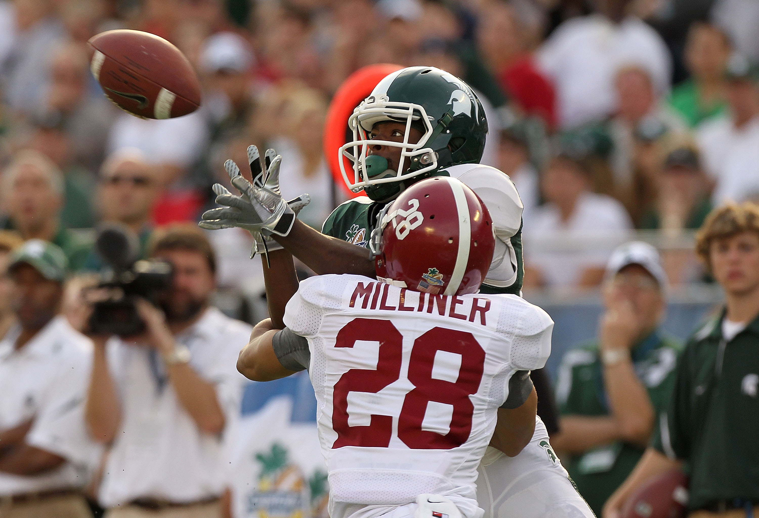 ORLANDO, FL - JANUARY 01:  Keshawn Martin #82 of the Michigan State Spartans has a pass broken up by DeMarcus Milliner #28 of the Alabama Crimson Tide during the Capitol One Bowl at the Florida Citrus Bowl on January 1, 2011 in Orlando, Florida.  (Photo b