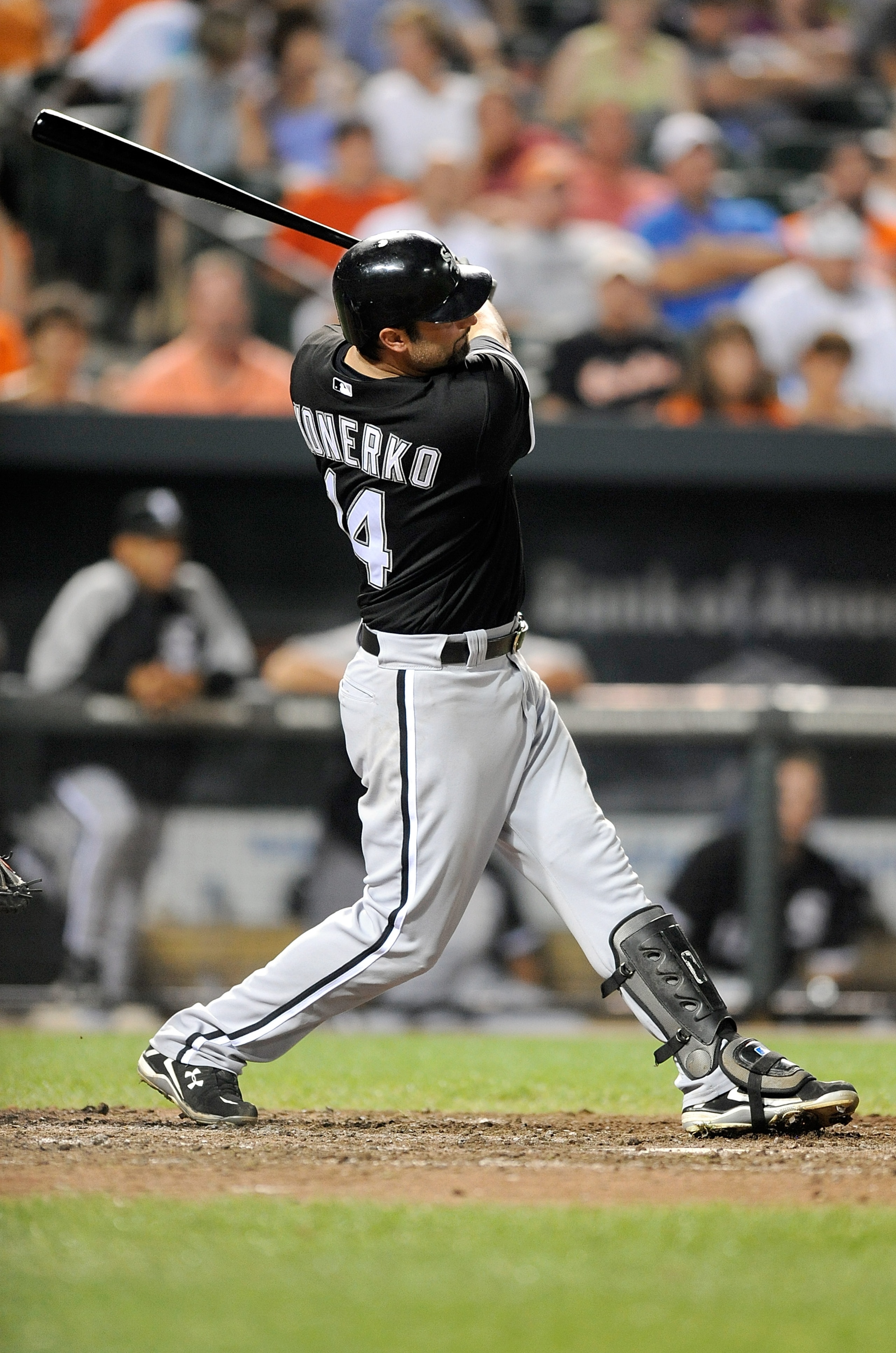 BALTIMORE - AUGUST 09:  Paul Konerko #14 of the Chicago White Sox hits a home run in the ninth inning against the Baltimore Orioles at Camden Yards on August 9, 2010 in Baltimore, Maryland.  (Photo by Greg Fiume/Getty Images)