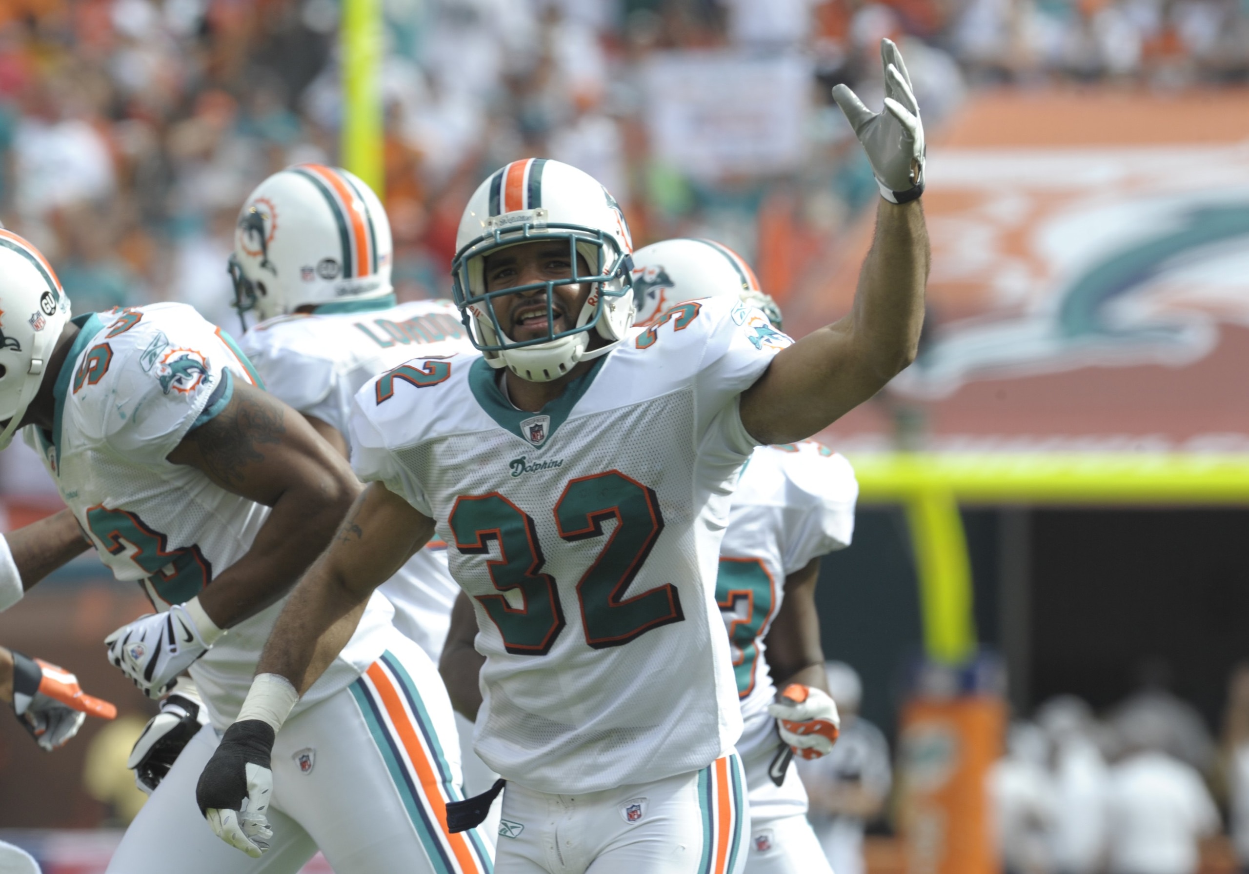 MIAMI, FL - JANUARY 4:  Cornerback Jason Allen #32 of the Miami Dolphins celebrates a defensive play against the Baltimore Ravens in an NFL Wildcard Playoff Game at Dolphins Stadium on January 4, 2009 in Miami, Florida.  (Photo by Al Messerschmidt/Getty I