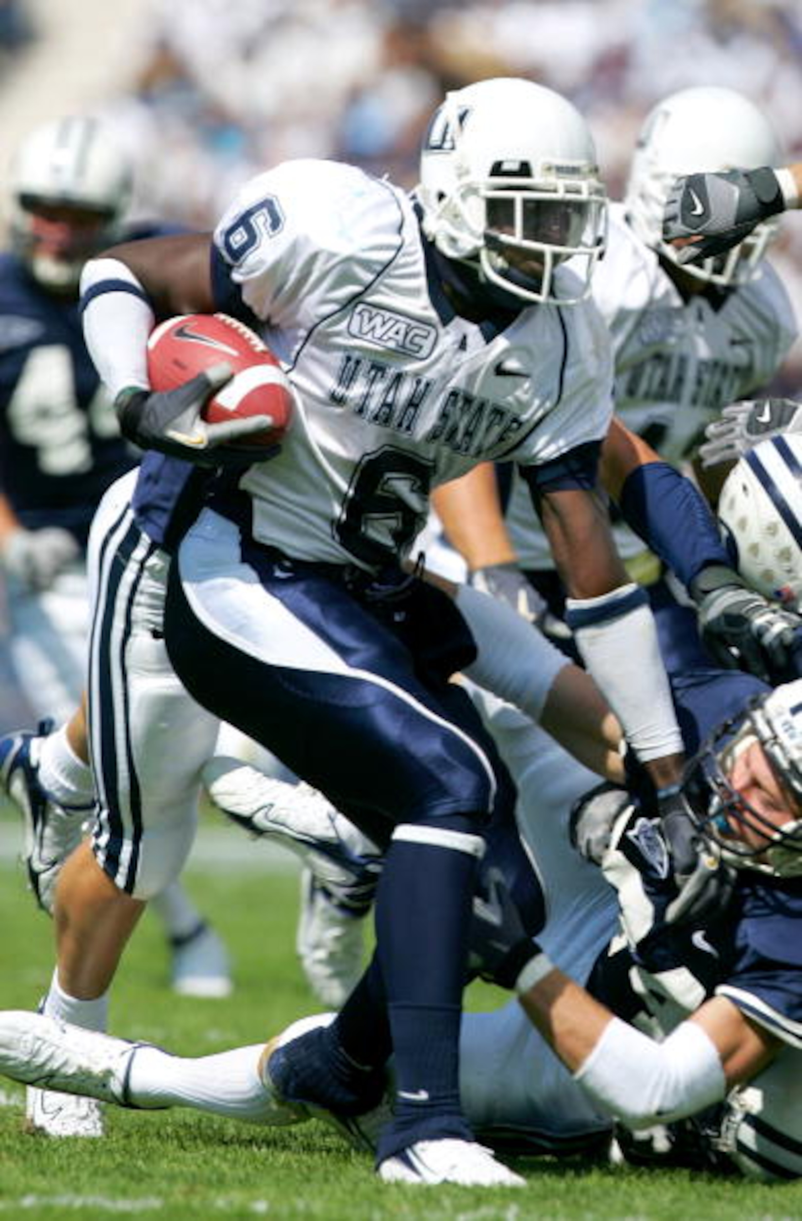 PROVO, UT - SEPTEMBER 23:  Kevin Robinson #6 of the Utah State Aggies runs with the ball against the Brigham Young Cougars on September 23, 2006 at La Vell Edwards Stadium in Provo, Utah.  (Photo By Kent Horner/Getty Images)