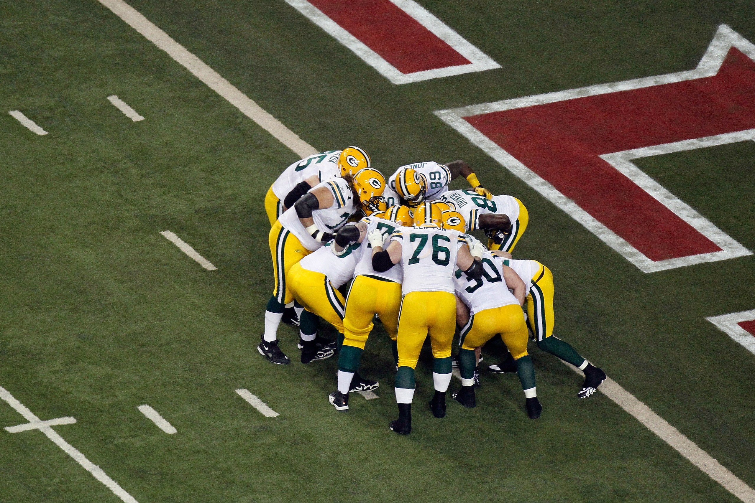 ATLANTA, GA - JANUARY 15:  The Green Bay Packers huddle on offense against the Atlanta Falcons during their 2011 NFC divisional playoff game at Georgia Dome on January 15, 2011 in Atlanta, Georgia. The Packers won 48-21. (Photo by Kevin C. Cox/Getty Image