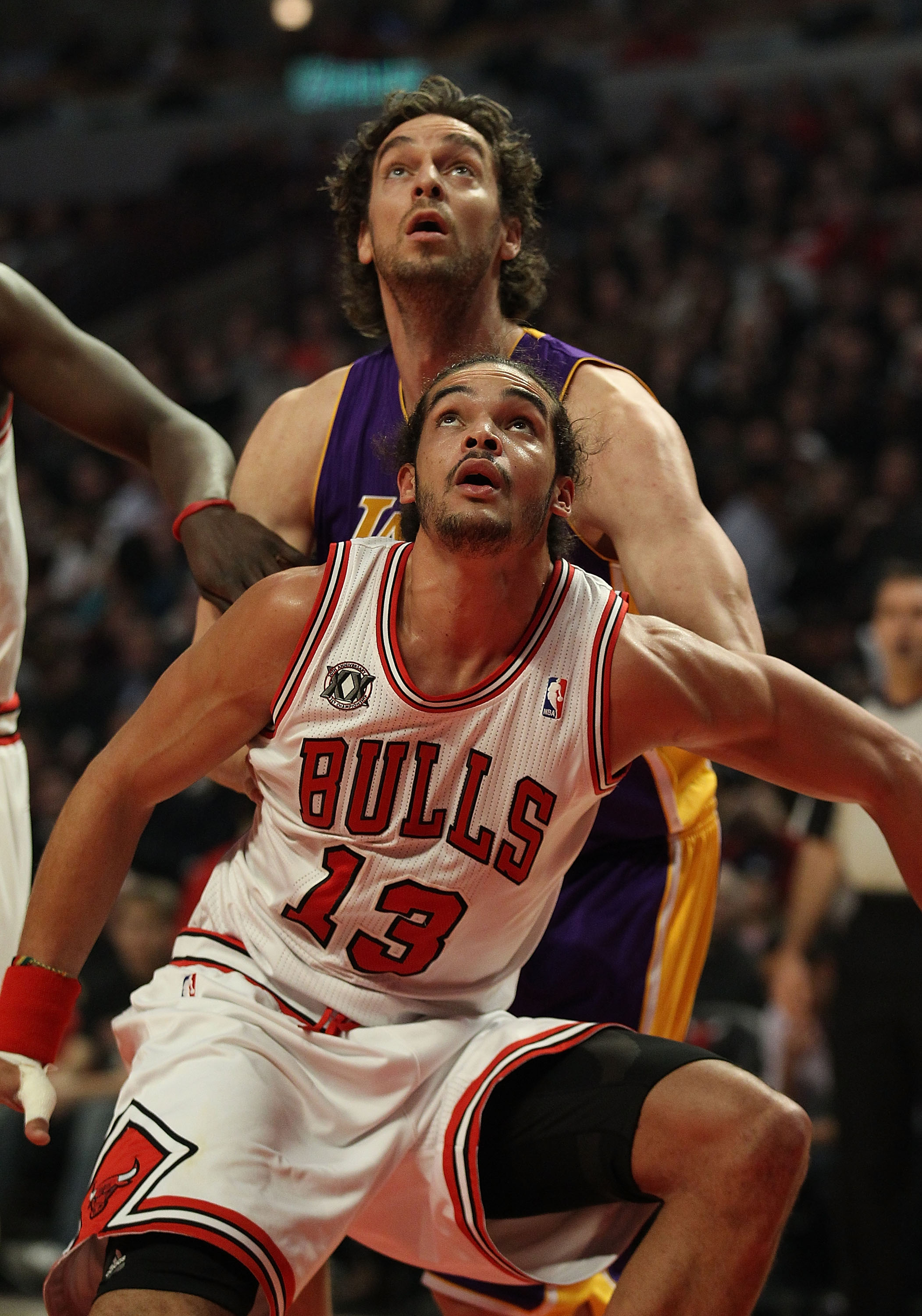 CHICAGO, IL - DECEMBER 10: Joakim Noah #13 of the Chicago Bulls boxes out Pau Gasol #16 of the Los Angeles Lakers at the United Center on December 10, 2010 in Chicago, Illinois. The Bulls defeated the Lakers 88-84. NOTE TO USER: User expressly acknowledge