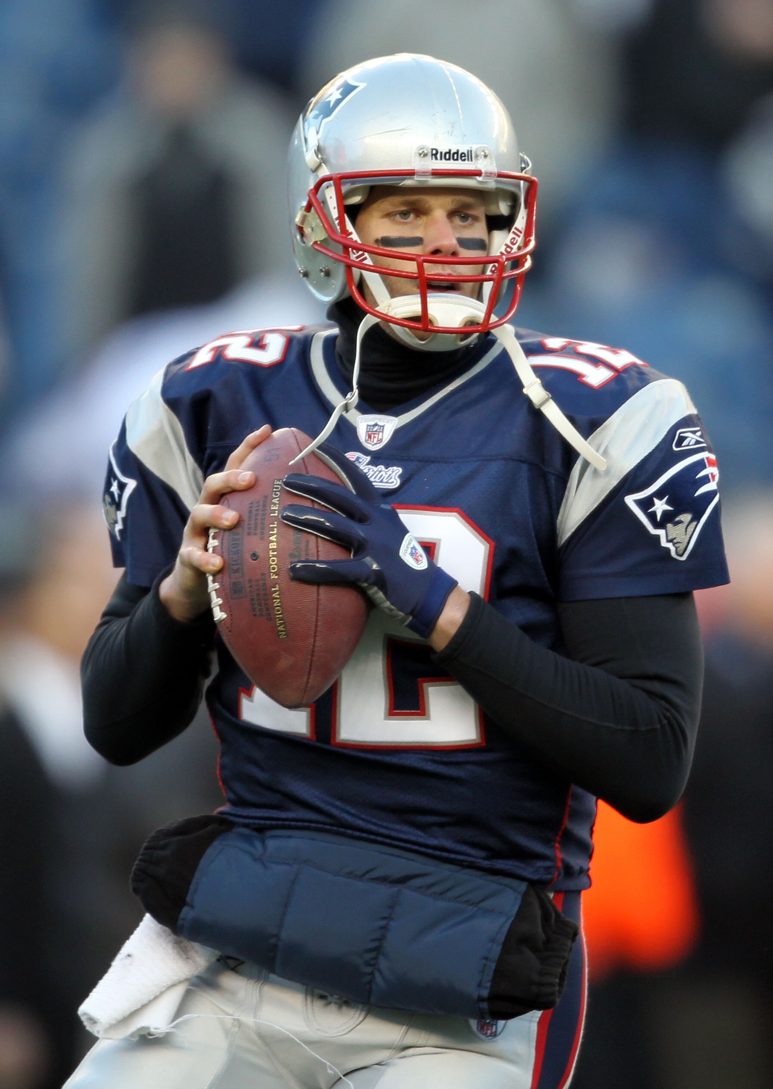 FOXBORO, MA - JANUARY 16:  Tom Brady #12 of the New England Patriots warms up prior to their game against the New York Jets during their 2011 AFC divisional playoff game at Gillette Stadium on January 16, 2011 in Foxboro, Massachusetts.  (Photo by Jim Rog