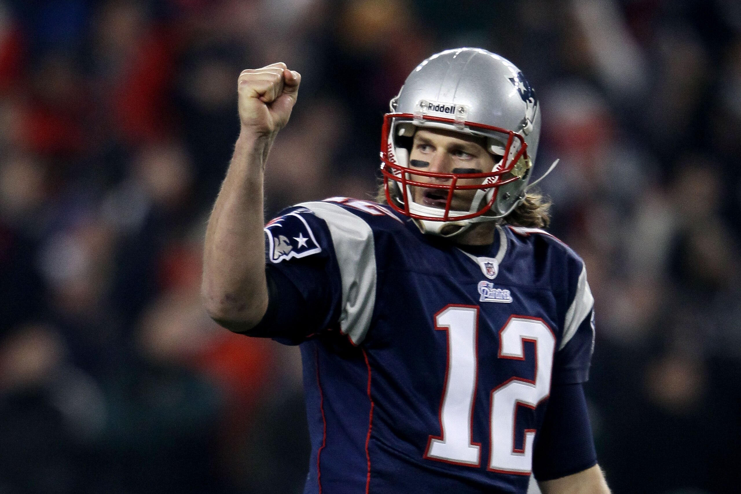 FOXBORO, MA - DECEMBER 19:  Quarterback Tom Brady #12 of the New England Patriots celebrates a touchdown scored by running back BenJarvus Green-Ellis #42 (not pictured) against the Green Bay Packers in the first quarter of the game at Gillette Stadium on