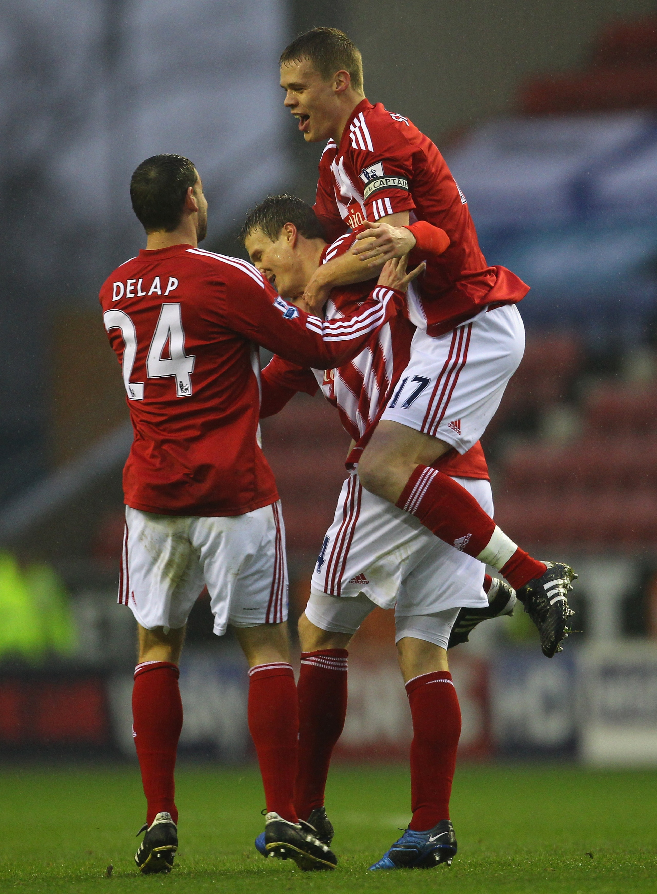 WIGAN, ENGLAND - DECEMBER 04:  Robert Huth of Stoke City is congratulated by Ryan Shawcross and Rory Delap after scoring the opening goal during the Barclays Premier League match between Wigan Athletic and Stoke City at DW Stadium on December 4, 2010 in W