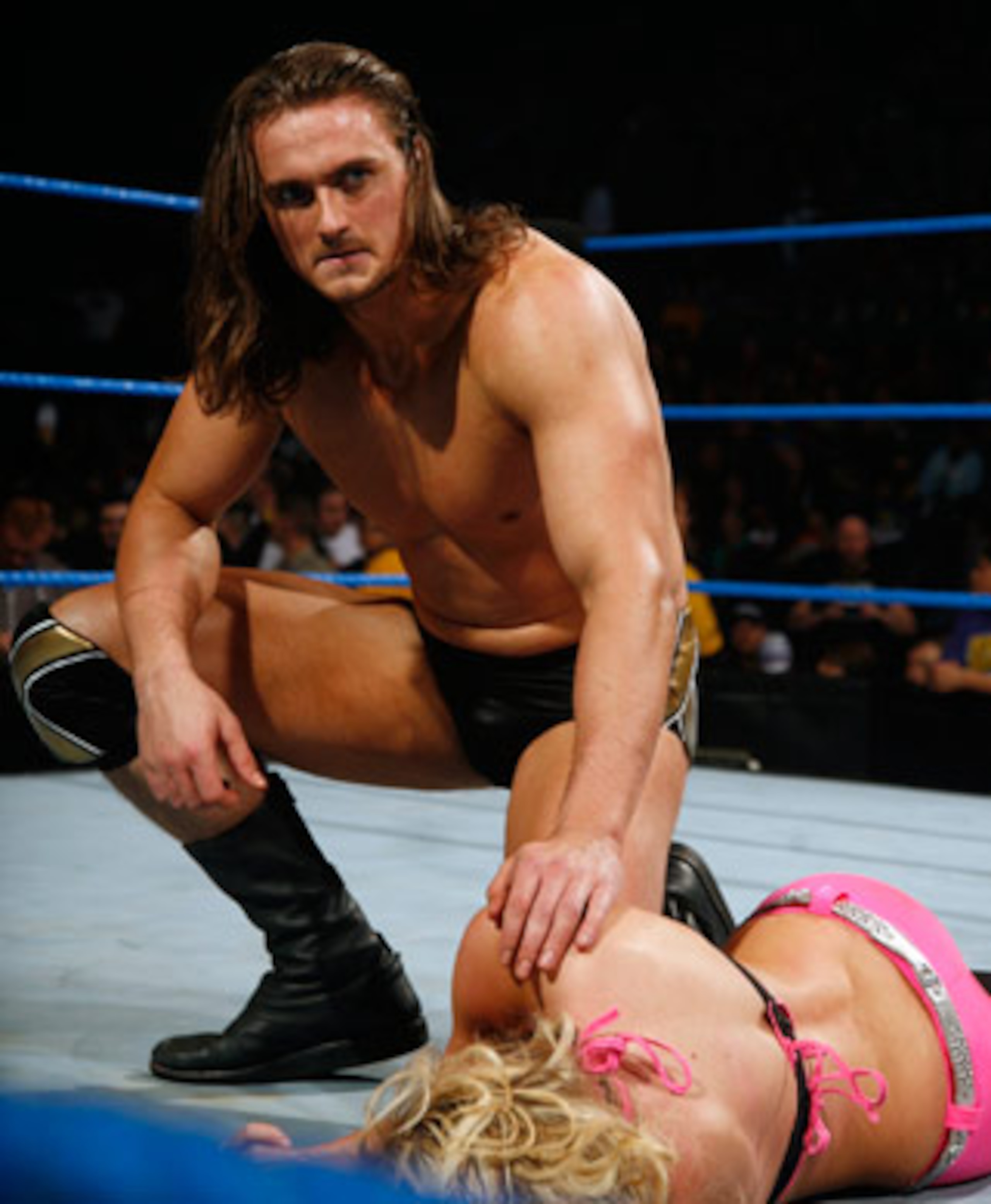 Drew McIntyre checking on Kelly Kelly, photo copyright to WWE.com