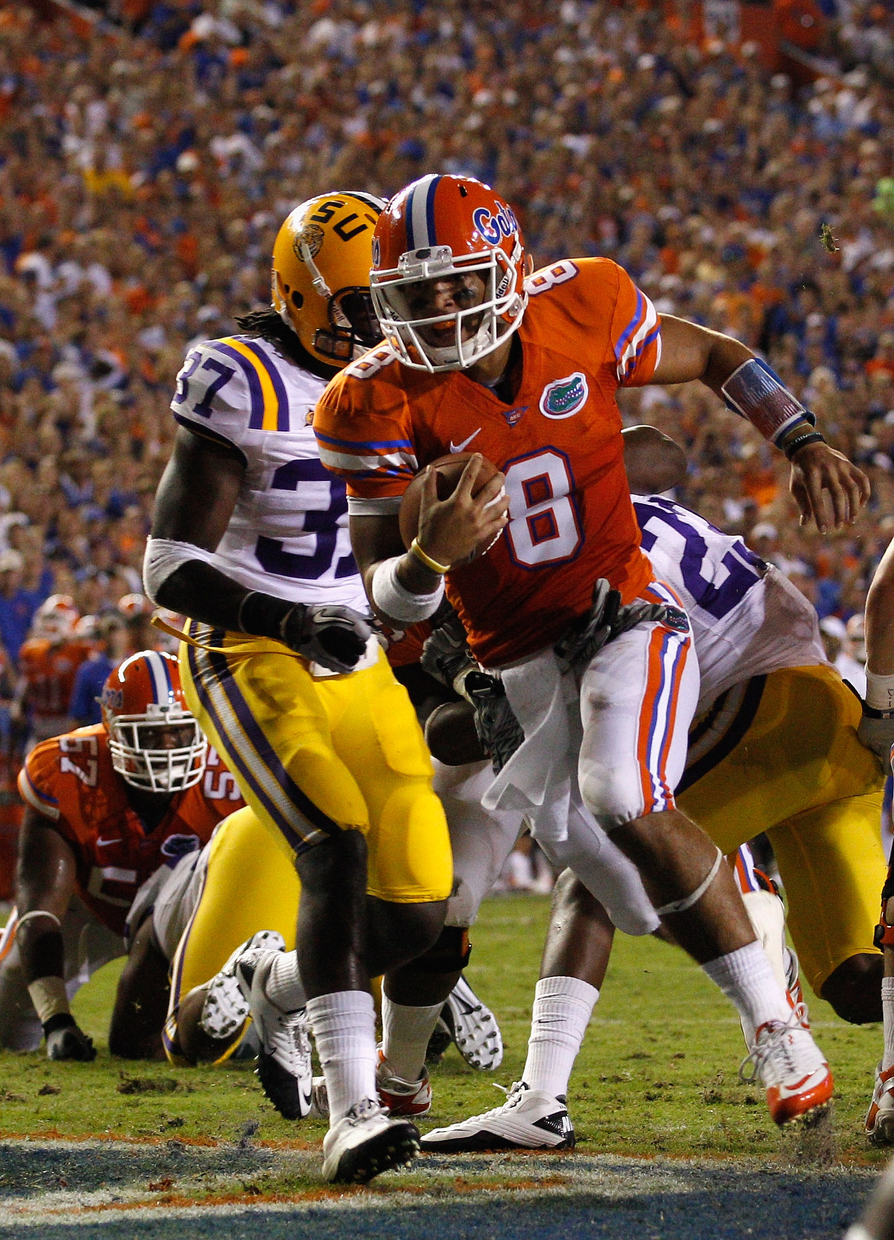 GAINESVILLE, FL - OCTOBER 09:  Quarterback Trey Burton #8 of the Florida Gators scores a touchdown during the game against the Louisiana State University Tigers at Ben Hill Griffin Stadium on October 9, 2010 in Gainesville, Florida.  (Photo by Sam Greenwo