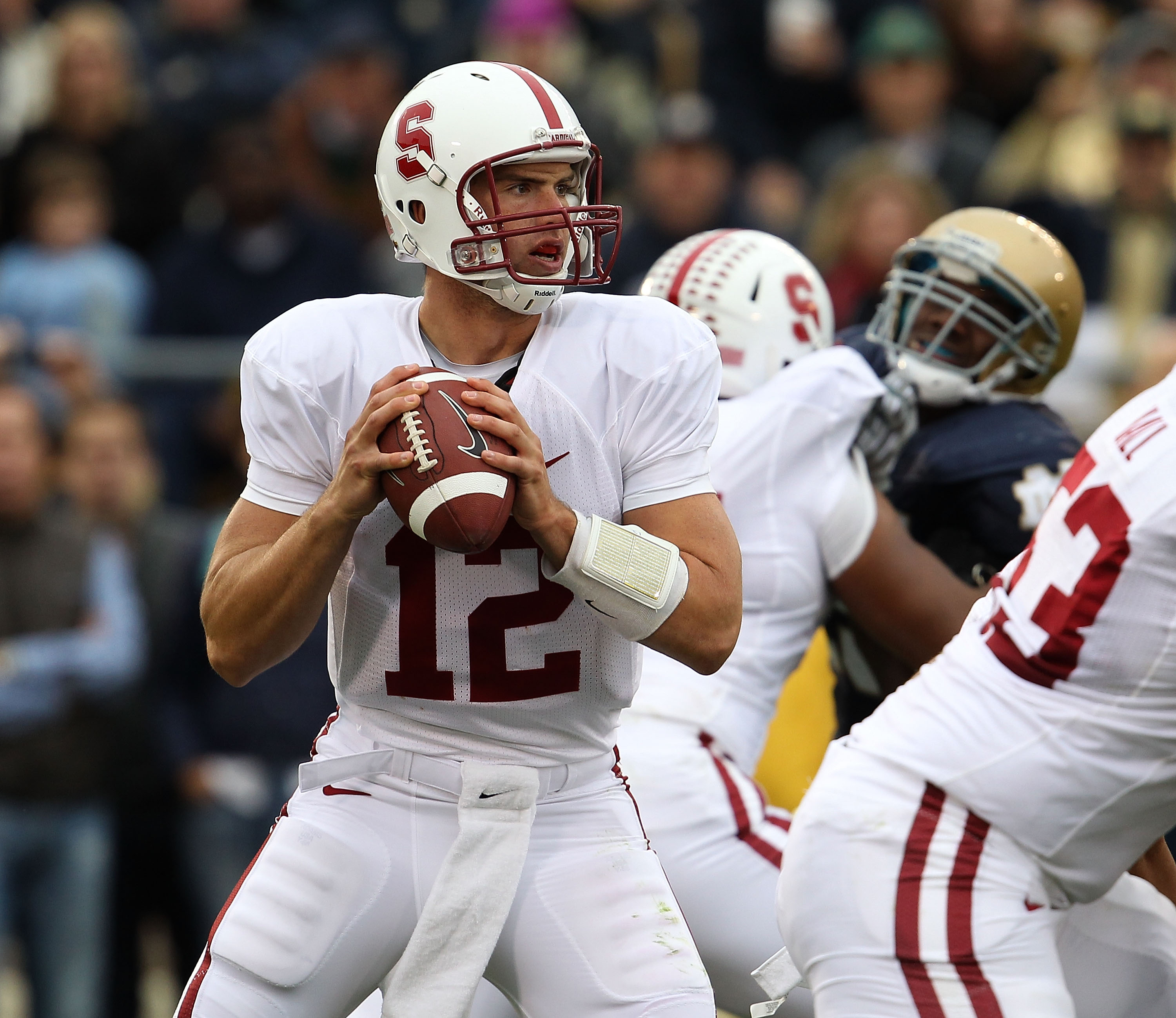 SOUTH BEND, IN - SEPTEMBER 25: Andrew Luck #12 of the Stanford Cardinal looks for a receiver against the Notre Dame Fighting Irish at Notre Dame Stadium on September 25, 2010 in South Bend, Indiana. Stanford defeated Notre Dame 37-14. (Photo by Jonathan D