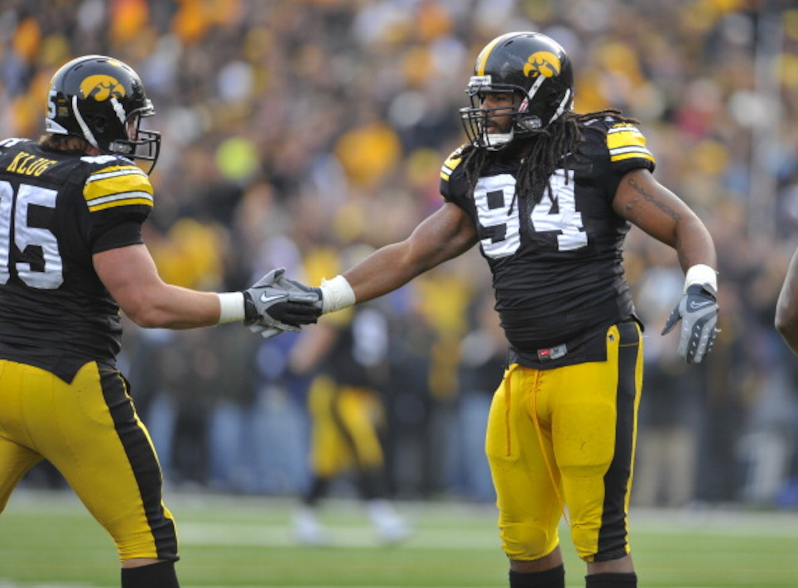IOWA CITY, IA - NOVEMBER 20:  Defensive linemen Adrian Clayborn #94 and Karly Klug #95 of the University of Iowa Hawkeyes celebrate a quarterback sack against the Ohio State Buckeyes during the first half of play at Kinnick Stadium on November 20, 2010 in