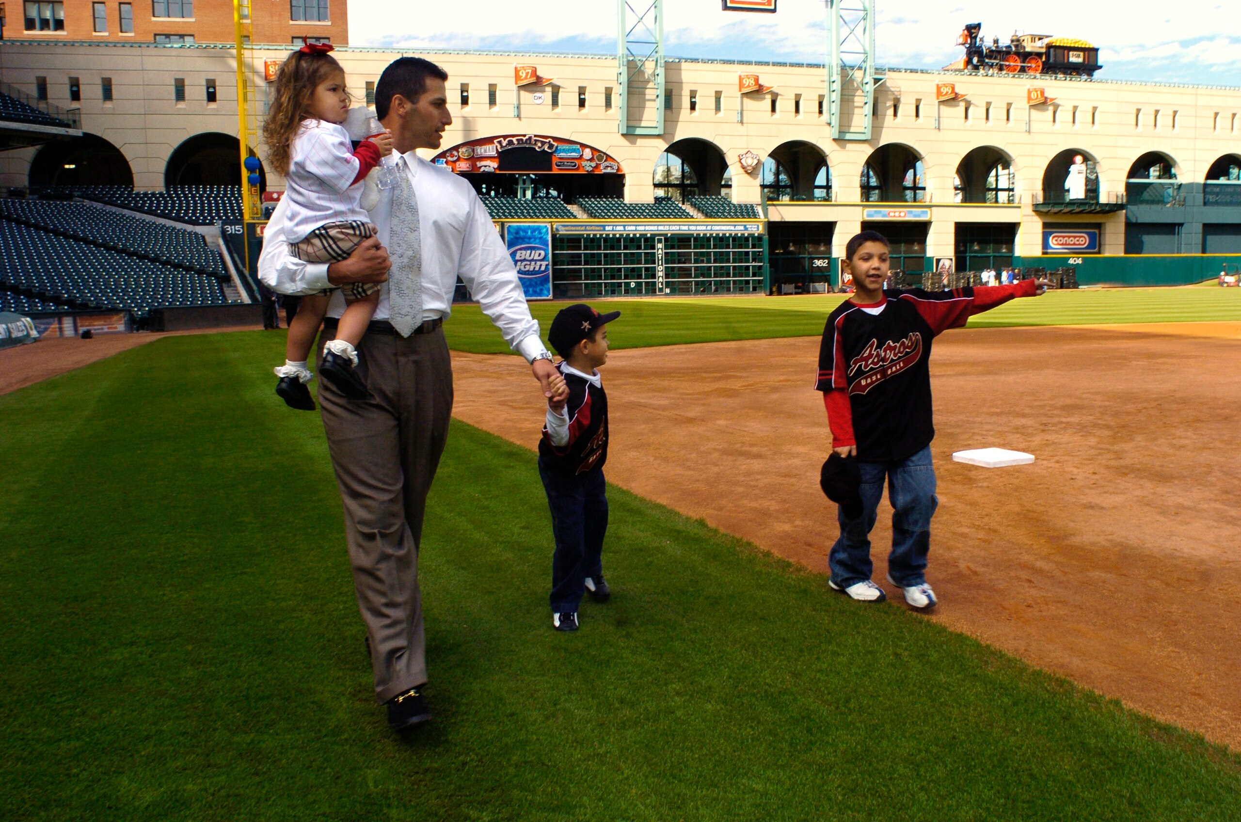 HOUSTON - DECEMBER 11:  Former New York Yankees pitcher Andy Pettitte, holds his daughter, Lexy, 2, as he walks with his sons Jared, 5, and Joshua, 9, far right, as they walk on the field at Minute Maid Park following a news conference announcing him as t