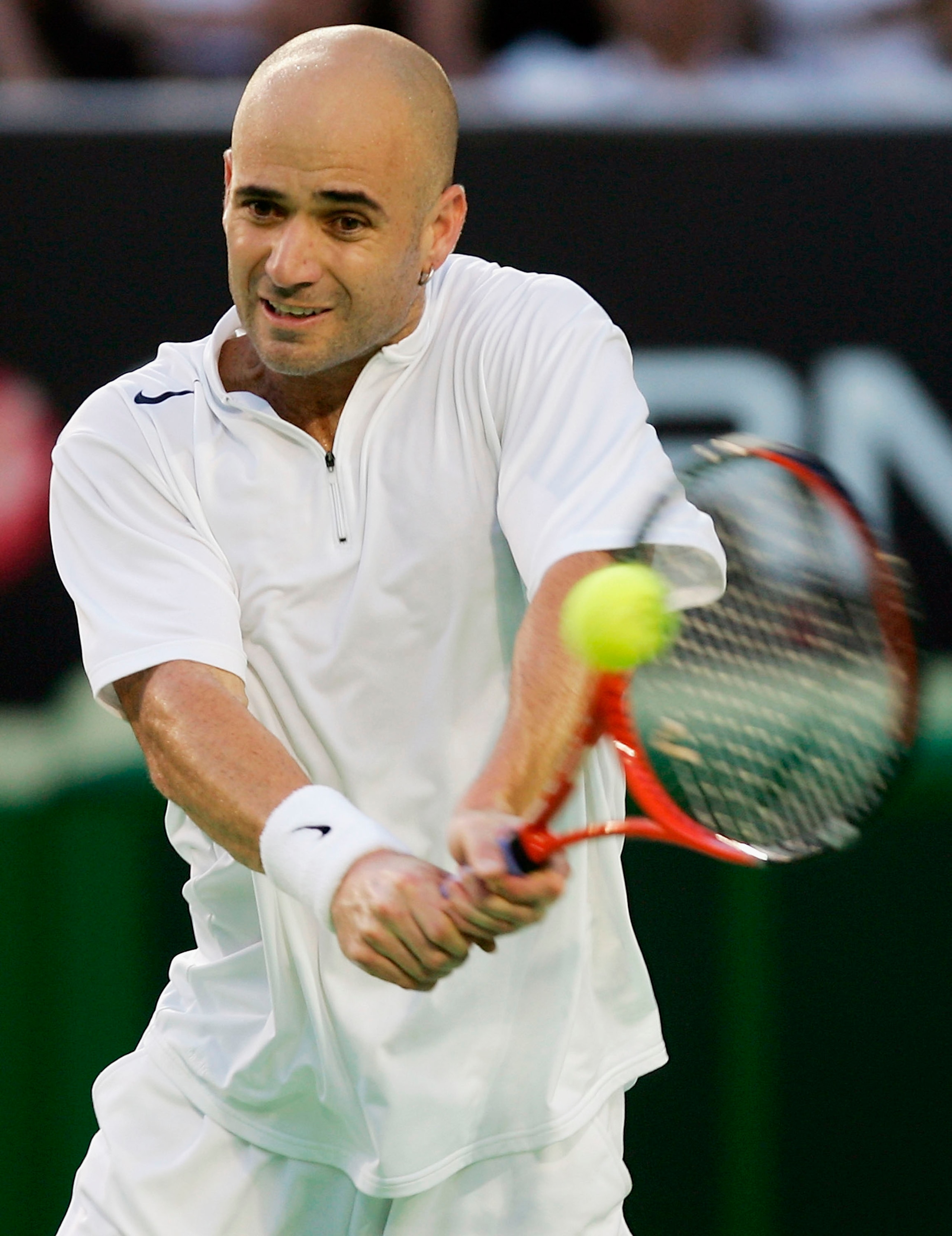 MELBOURNE, AUSTRALIA - JANUARY 25: Andre Agassi of the USA in action against Roger Federer of Switzerland during day nine of the Australian Open Grand Slam at Melbourne Park January 25, 2005 in Melbourne, Australia. (Photo by Clive Brunskill/Getty Images MELBOURNE, AUSTRALIA - JANUARY 25: Andre Agassi of the USA in action against Roger Federer of Switzerland during day nine of the Australian Open Grand Slam at Melbourne Park January 25, 2005 in Melbourne, Australia. (Photo by Clive Brunskill/Getty Images