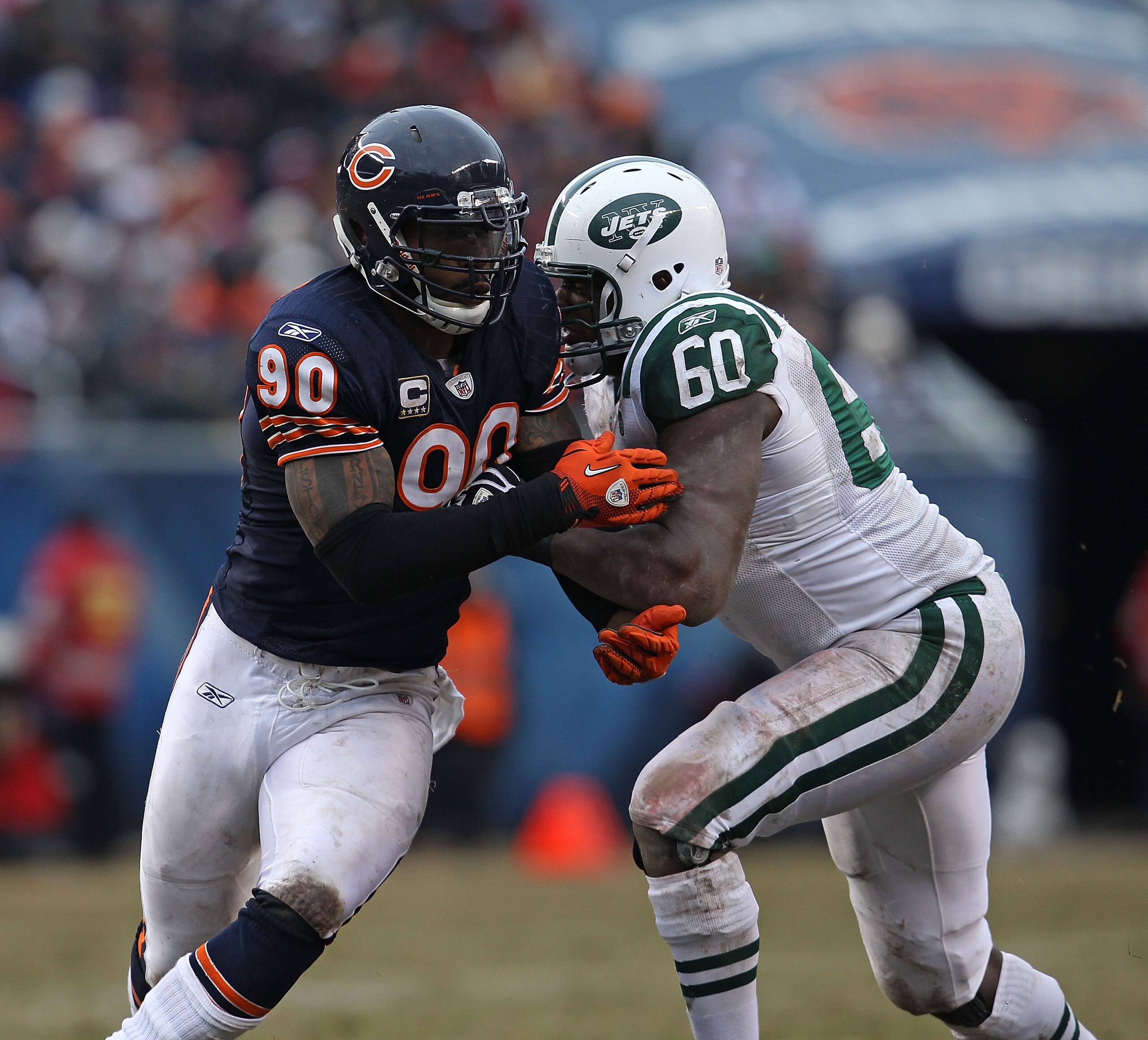 CHICAGO, IL - DECEMBER 26: Julius Peppers #90 of the Chicago Bears rushes against D' Brickashaw Ferguson #60 of the New York Jets at Soldier Field on December 26, 2010 in Chicago, Illinois. The Bears defeated the Jets 38-34. (Photo by Jonathan Daniel/Gett