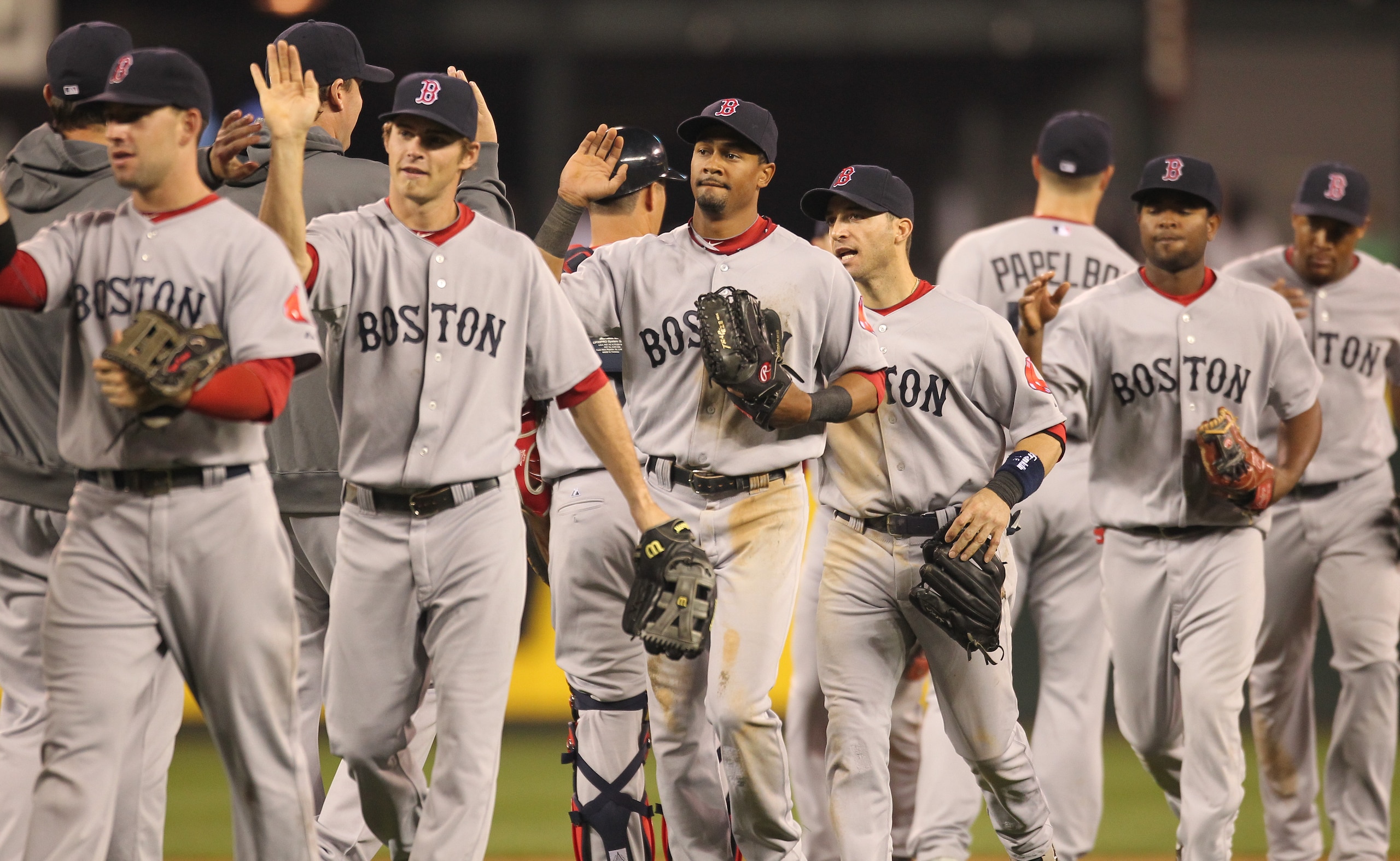 SEATTLE - SEPTEMBER 14:  Members of the Boston Red Sox celebrate after defeating the Seattle Mariners 9-6 at Safeco Field on September 14, 2010 in Seattle, Washington. The Red Sox won 9-6. (Photo by Otto Greule Jr/Getty Images)