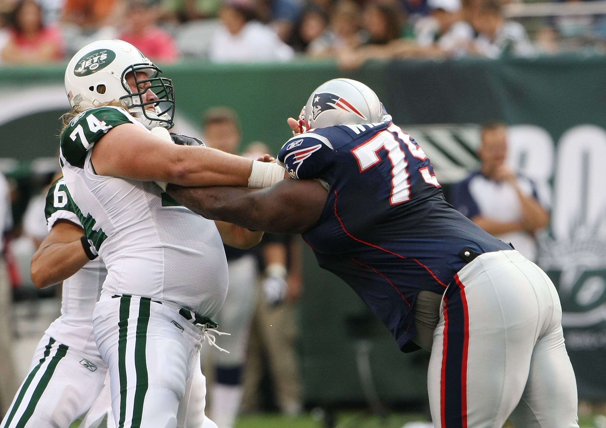 EAST RUTHERFORD, NJ - SEPTEMBER 19:  Nick Mangold #74 of the New York Jets blocks Vince Wilfork #74 of the New England Patriots during their  game on September 19, 2010 at the New Meadowlands Stadium  in East Rutherford, New Jersey.  (Photo by Al Bello/Ge