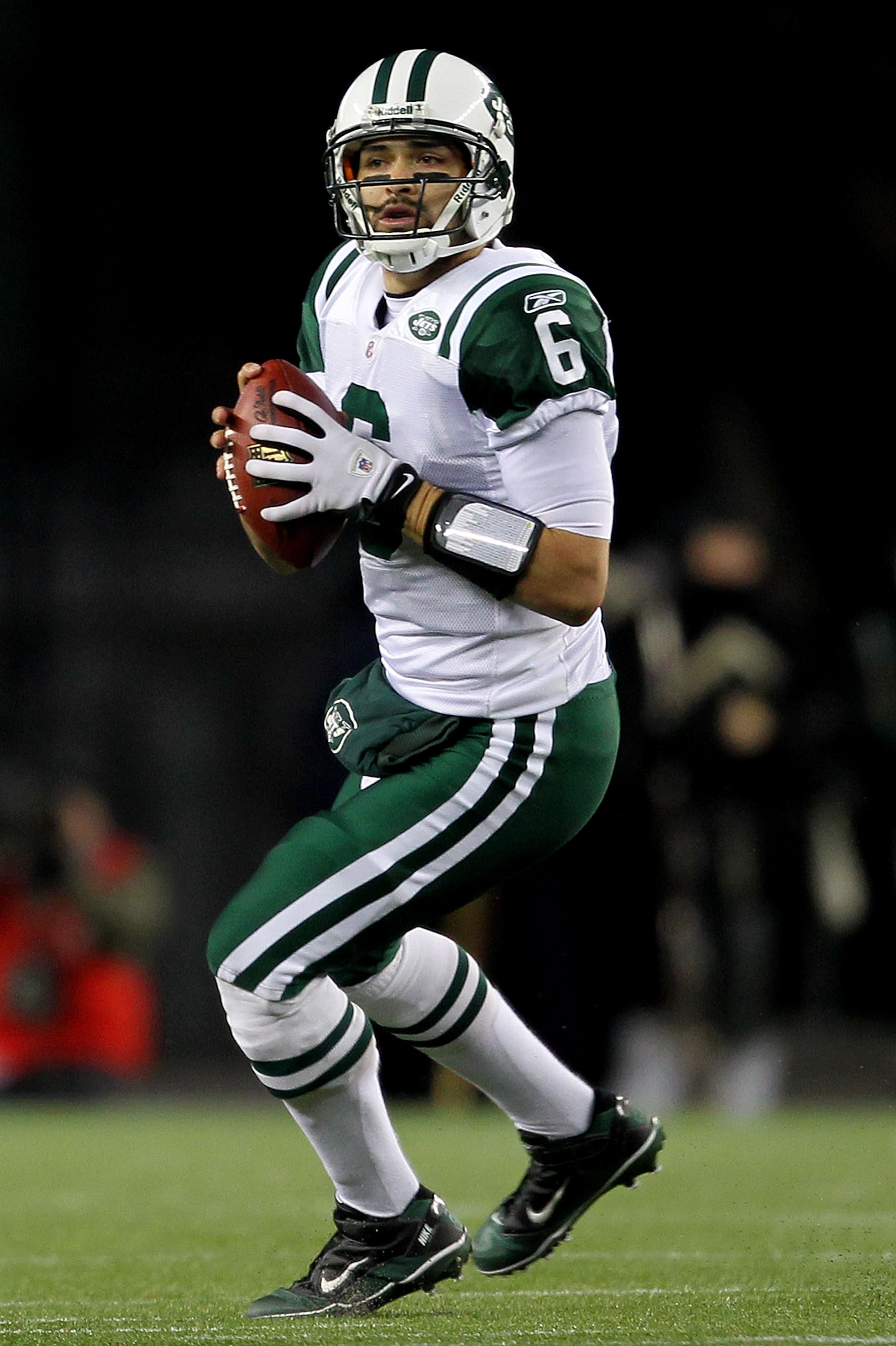 FOXBORO, MA - JANUARY 16:  Mark Sanchez #6 of the New York Jets drops back during their 2011 AFC divisional playoff game against the New England Patriots at Gillette Stadium on January 16, 2011 in Foxboro, Massachusetts.  (Photo by Jim Rogash/Getty Images