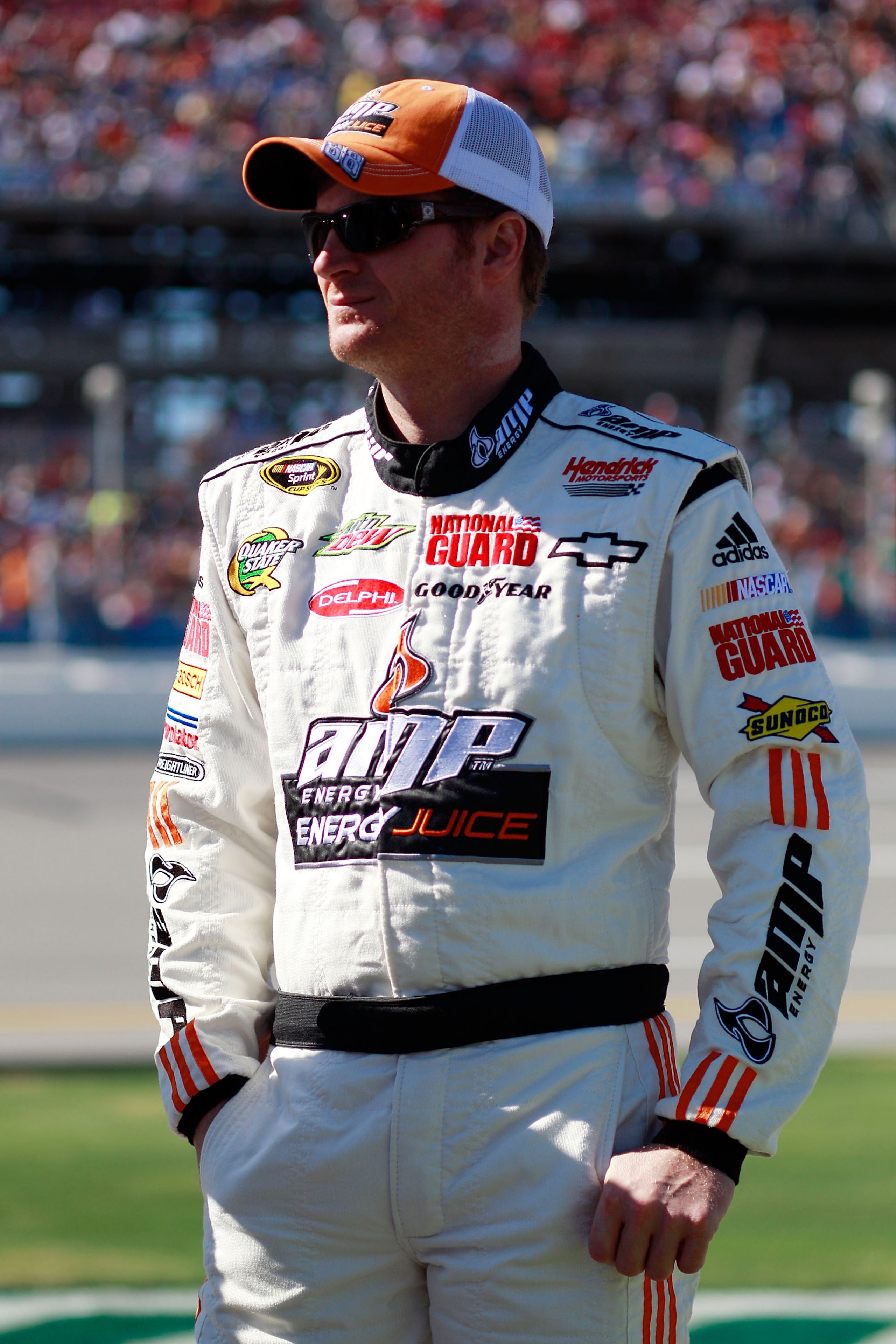 TALLADEGA, AL - OCTOBER 31:  Dale Earnhardt Jr., driver of the #88 Amp Energy Juice/National Guard Chevrolet, stands on pit road before the NASCAR Sprint Cup Series AMP Energy Juice 500 at Talladega Superspeedway on October 31, 2010 in Talladega, Alabama.