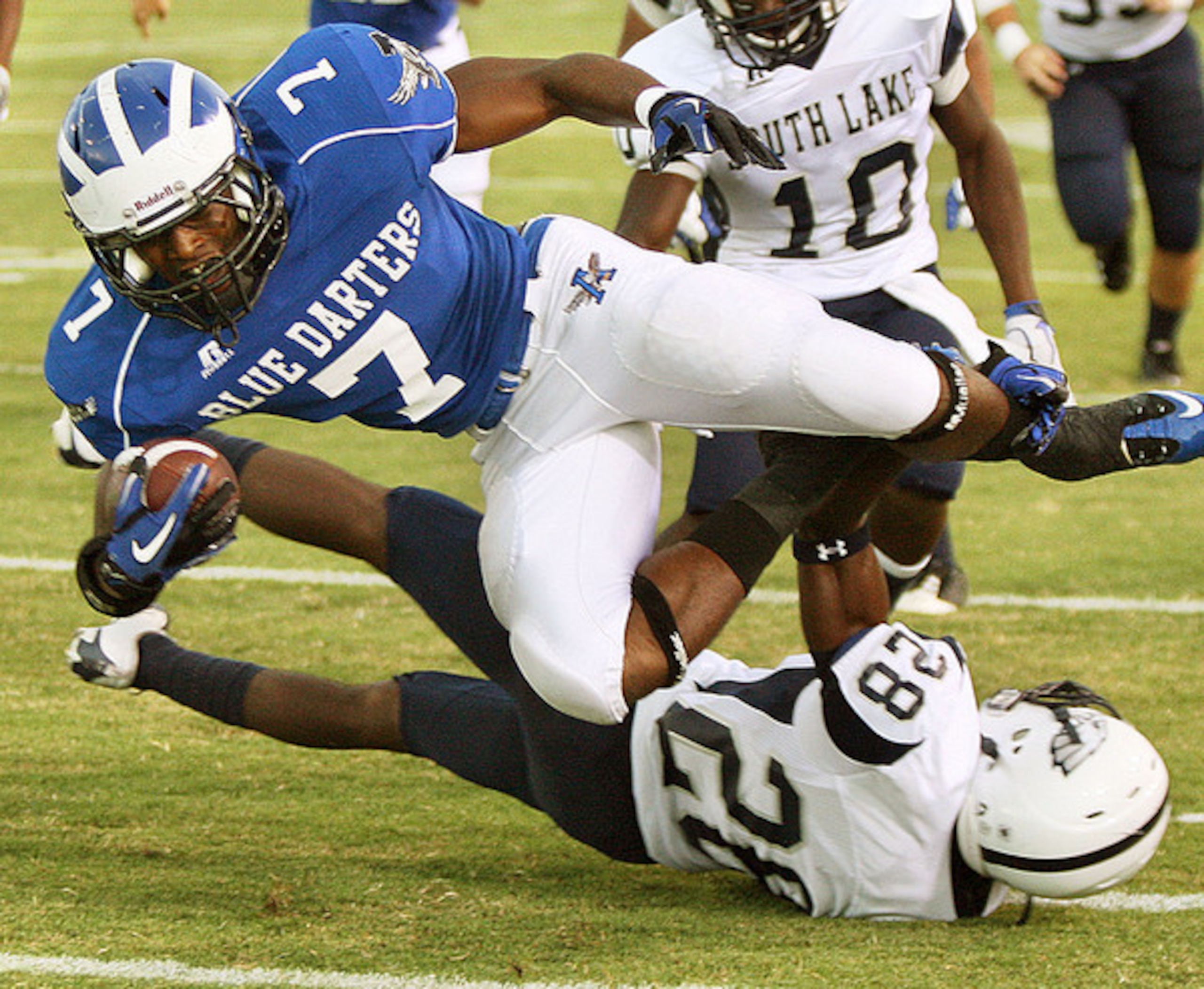 Tom Smith runs through and over a South Lake defensive back. Tom Smith runs through and over a South Lake defensive back.