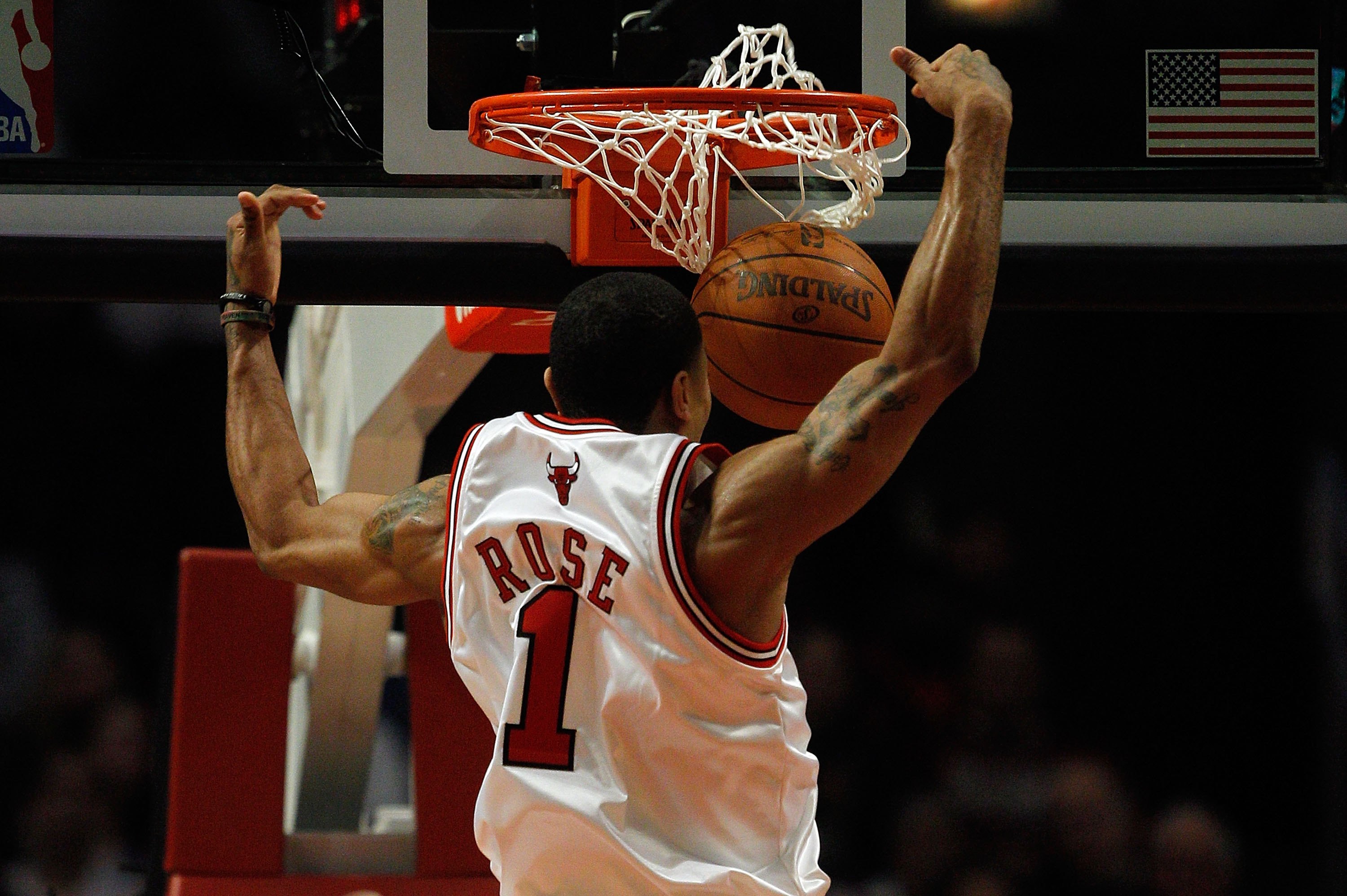 Chicago Bulls' Derrick Rose (1) dunks the ball during the second half of an  NBA basketball game against the New York Knicks Tuesday, April 12, 2011, in  New York. The Bulls won