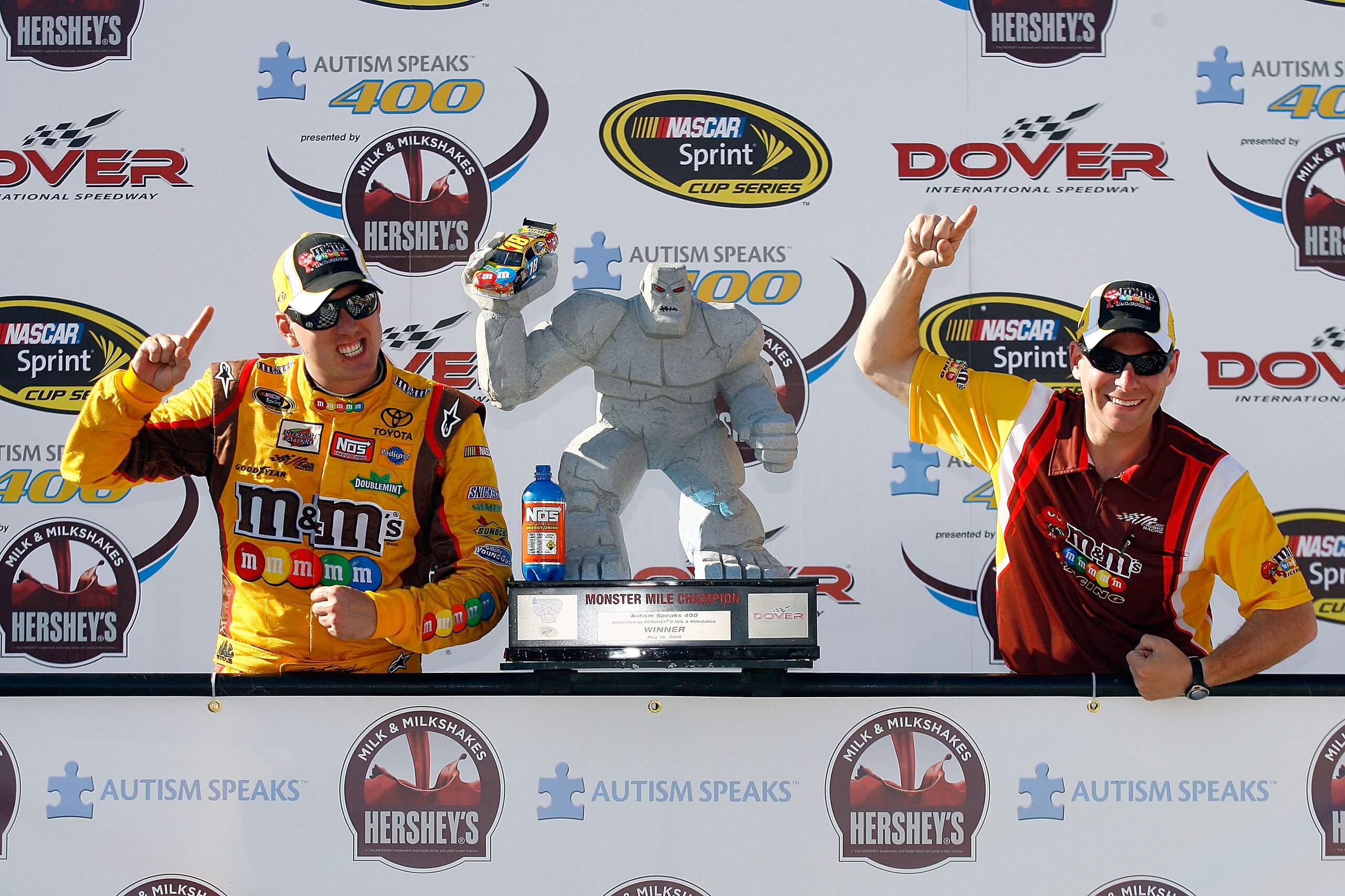 DOVER, DE - MAY 16:  Kyle Busch (L), driver of the #18 M&M's Toyota, and crew chief Dave Rogers poses in Victory Lane after winning the NASCAR Sprint Cup Series Autism Speaks 400 at Dover International Speedway on May 16, 2010 in Dover, Delaware.  (Photo