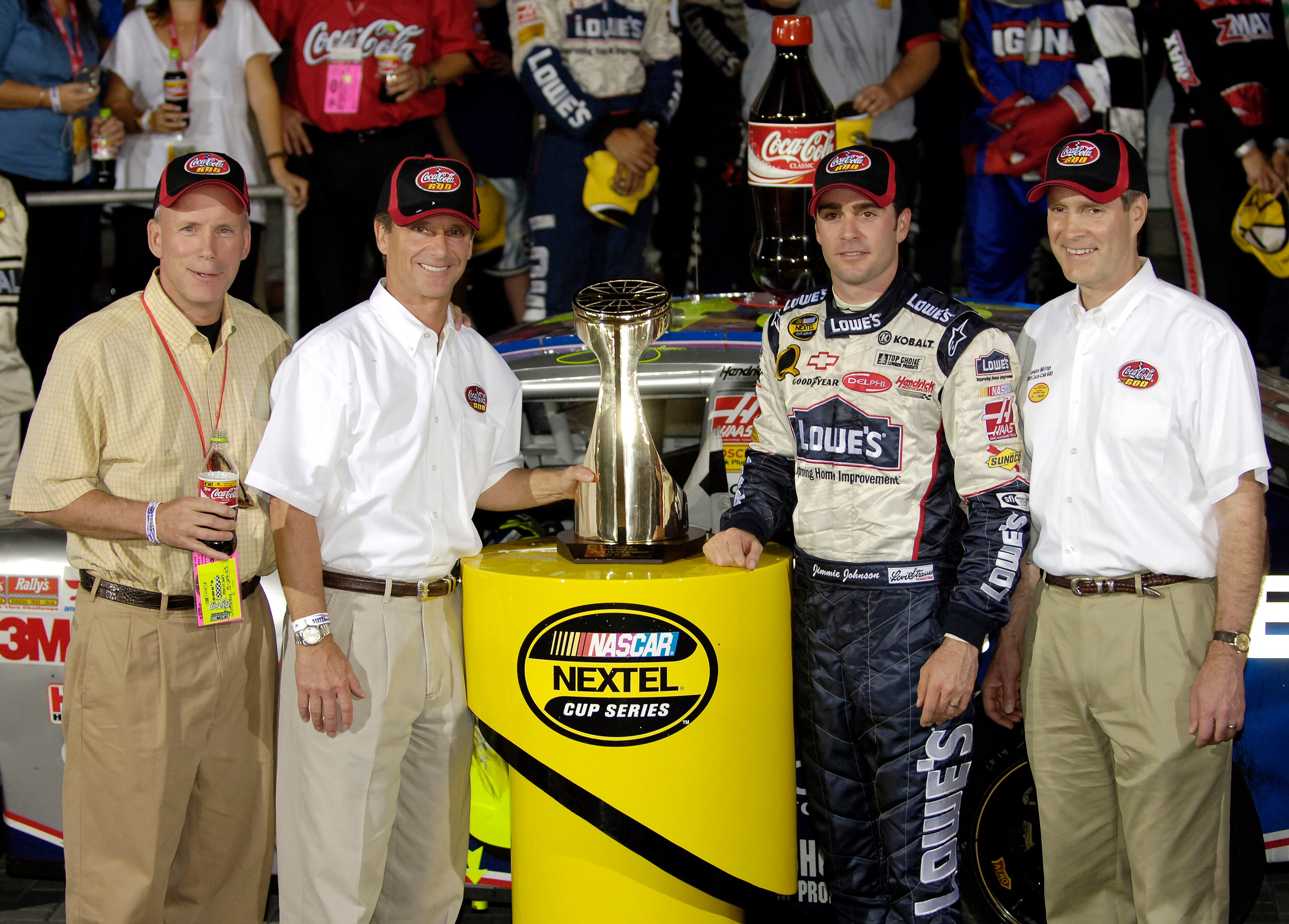CONCORD, NC - MAY 29:  Jimmie Johnson, driver of the #48 Lowe's Chevrolet, poses with Senator Bill Frist (R-TN) (R) in Victory Lane after winning the NASCAR Nextel Cup Series Coca-Cola 600 on May 29, 2005 at the Lowe's Motor Speedway in Concord, North Car