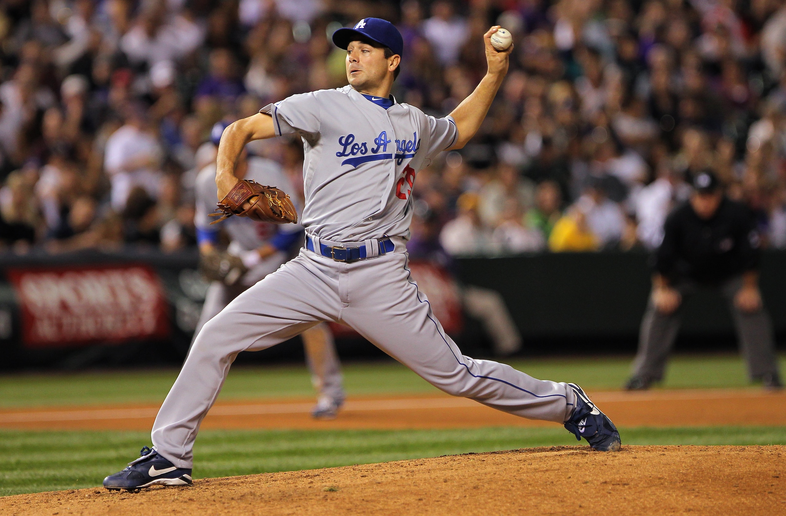 DENVER - SEPTEMBER 27:  Starting pitcher Ted Lilly #29 of the Los Angeles Dodgers delivers against the Colorado Rockies at Coors Field on September 25, 2010 in Denver, Colorado. Lilly earned the win as the Dodgers defeated the Rockies 3-1.  (Photo by Doug