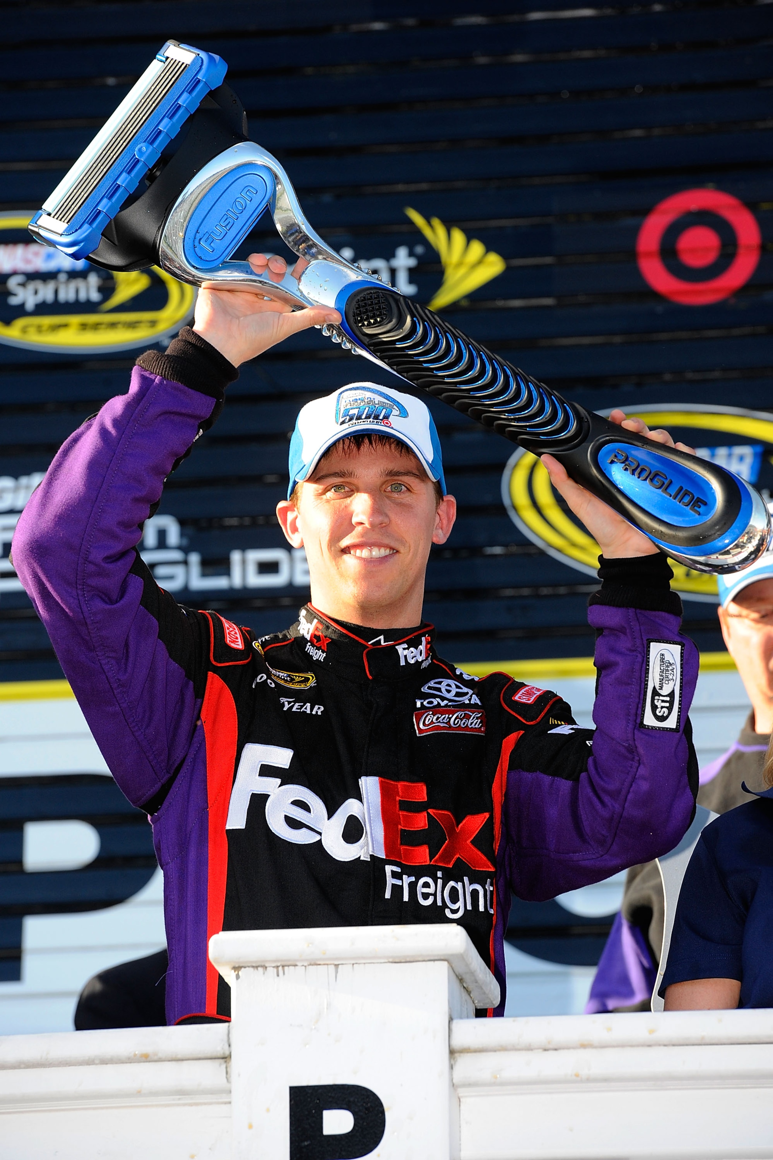 LONG POND, PA - JUNE 06:  Denny Hamlin, driver of the #11 FedEx Freight Toyota, celebrates in victory lane after winning the NASCAR Sprint Cup Series Gillette Fusion ProGlide 500 at Pocono Raceway on June 6, 2010 in Long Pond, Pennsylvania.  (Photo by Joh