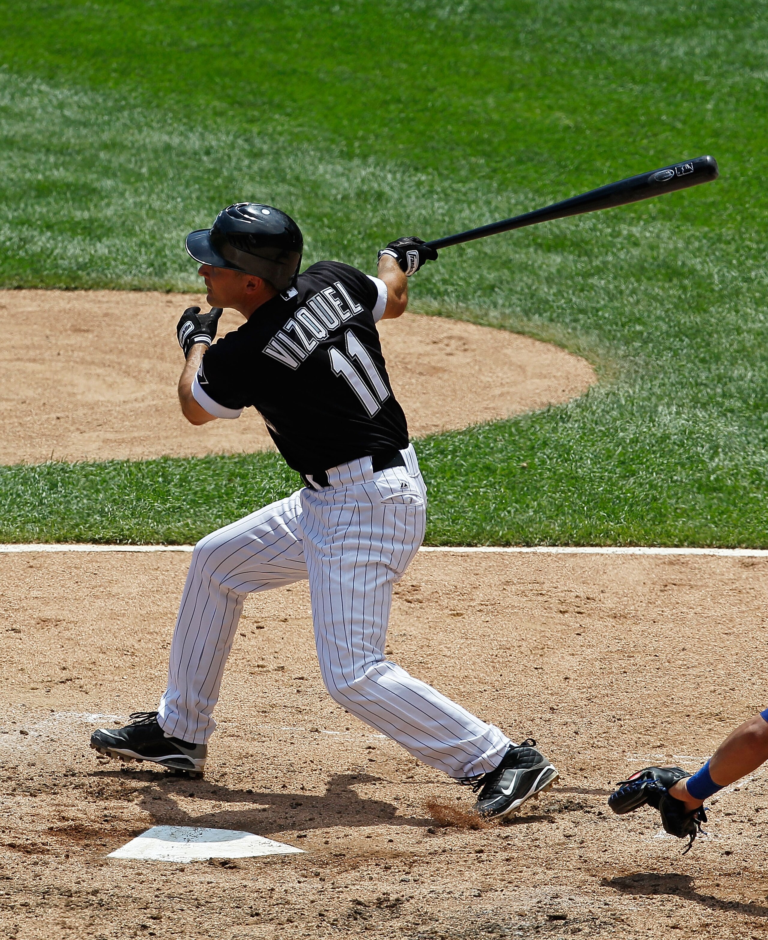 CHICAGO - JUNE 27: Omar Vizquel #11 of the Chicago White Sox takes a swing against the Chicago Cubs at U.S. Cellular Field on June 27, 2010 in Chicago, Illinois. The Cubs defeated the White Sox 8-6. (Photo by Jonathan Daniel/Getty Images)