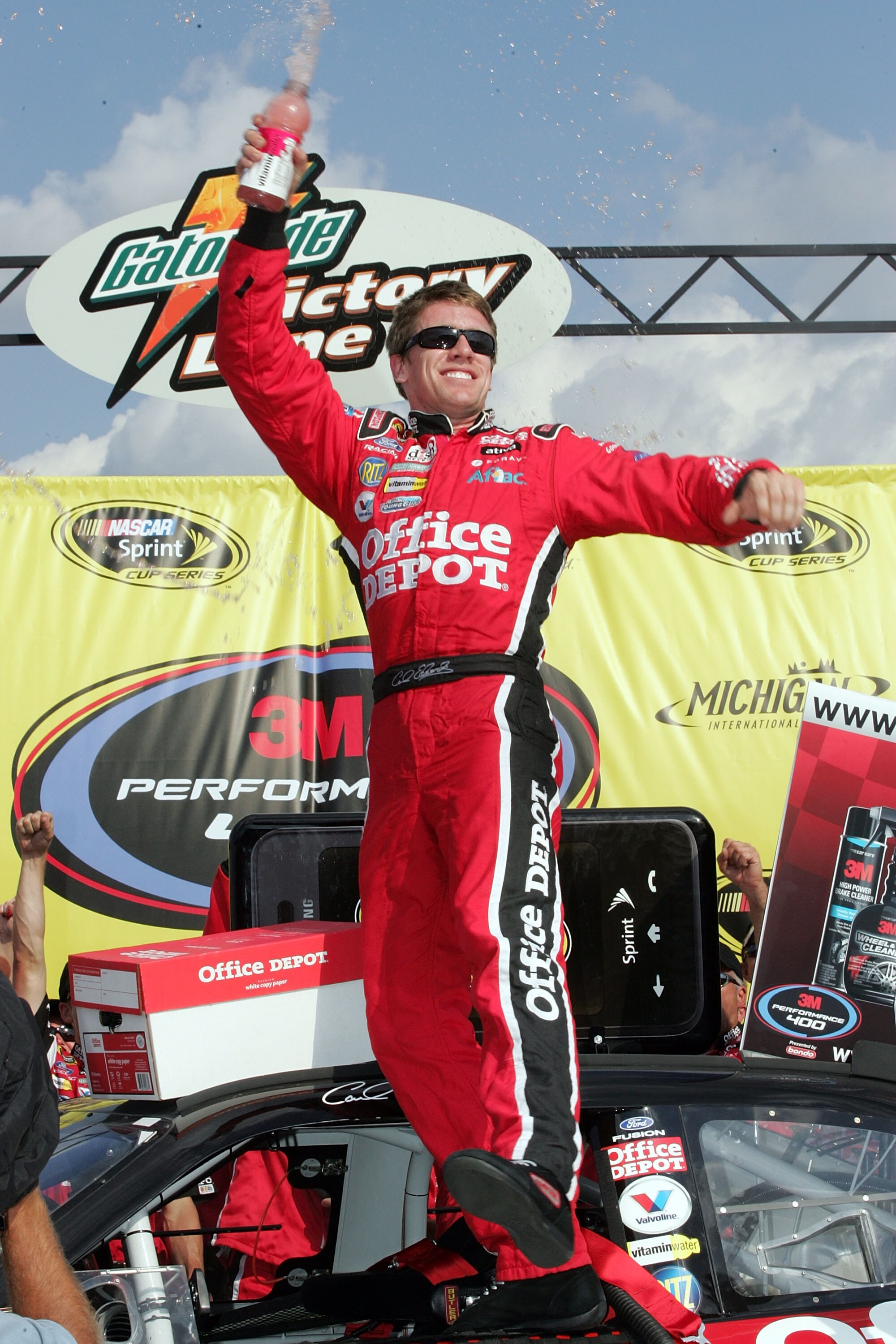 BROOKLYN, MI - AUGUST 17:  Carl Edwards, driver of the #99 Office Depot Ford, celebrates in victory lane after winning the NASCAR Sprint Cup Series 3M Performance 400 at Michigan International Speedway on August 17, 2008 in Brooklyn, Michigan.  (Photo by