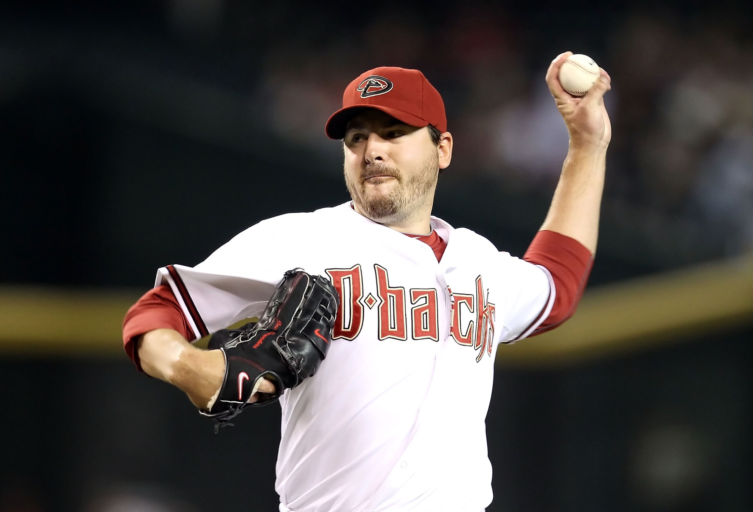PHOENIX - SEPTEMBER 21:  Starting pitcher Joe Saunders #34 of the Arizona Diamondbacks pitches against the Colorado Rockies during the Major League Baseball game at Chase Field on September 21, 2010 in Phoenix, Arizona.  (Photo by Christian Petersen/Getty