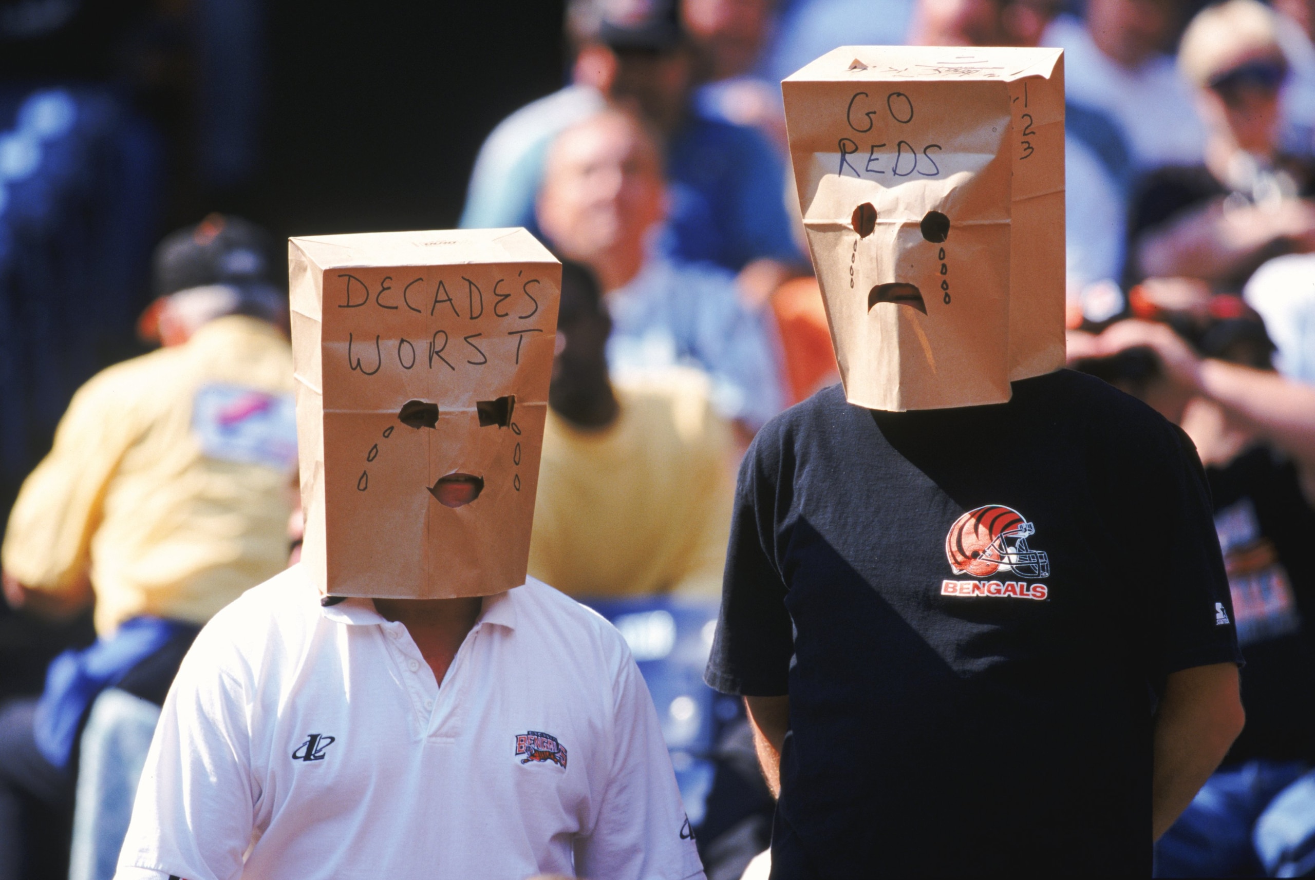 3 Oct 1999: Fans of the Cincinnati Bengals wear unhappy paper bag faces crying about the Cincinnati Reds worst season during a game against the St. Louis Rams at the Riverfront Stadium in Cincinnati, Ohio. The Rams defeated the Bengals 38-10. Mandatory Cr