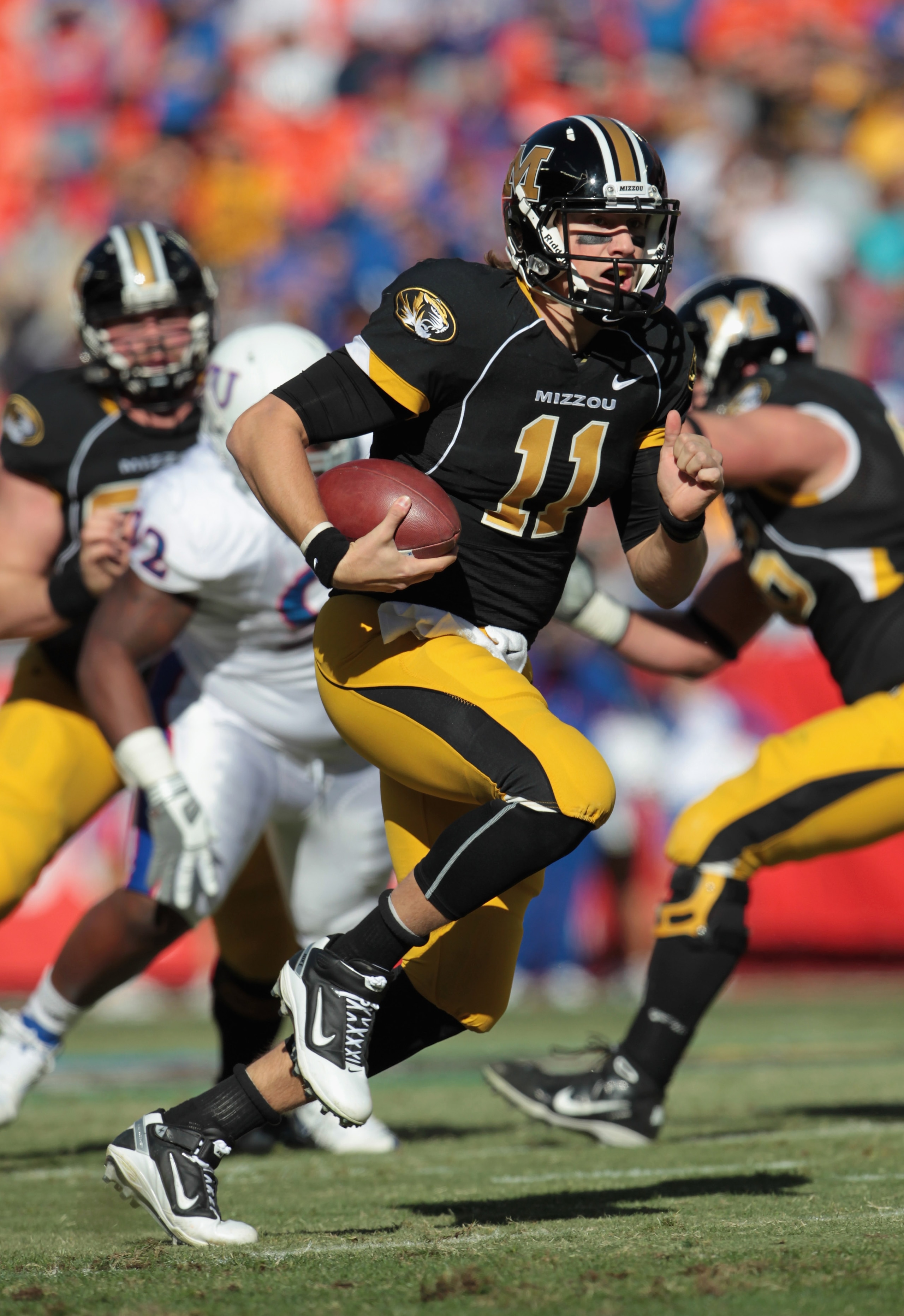 KANSAS CITY, MO - NOVEMBER 27:  Quarterback Blaine Gabbert #11 of the Missouri Tigers carries the ball during the game against the Kansas Jayhawks on November 27, 2010 at Arrowhead Stadium in Kansas City, Missouri.  (Photo by Jamie Squire/Getty Images)