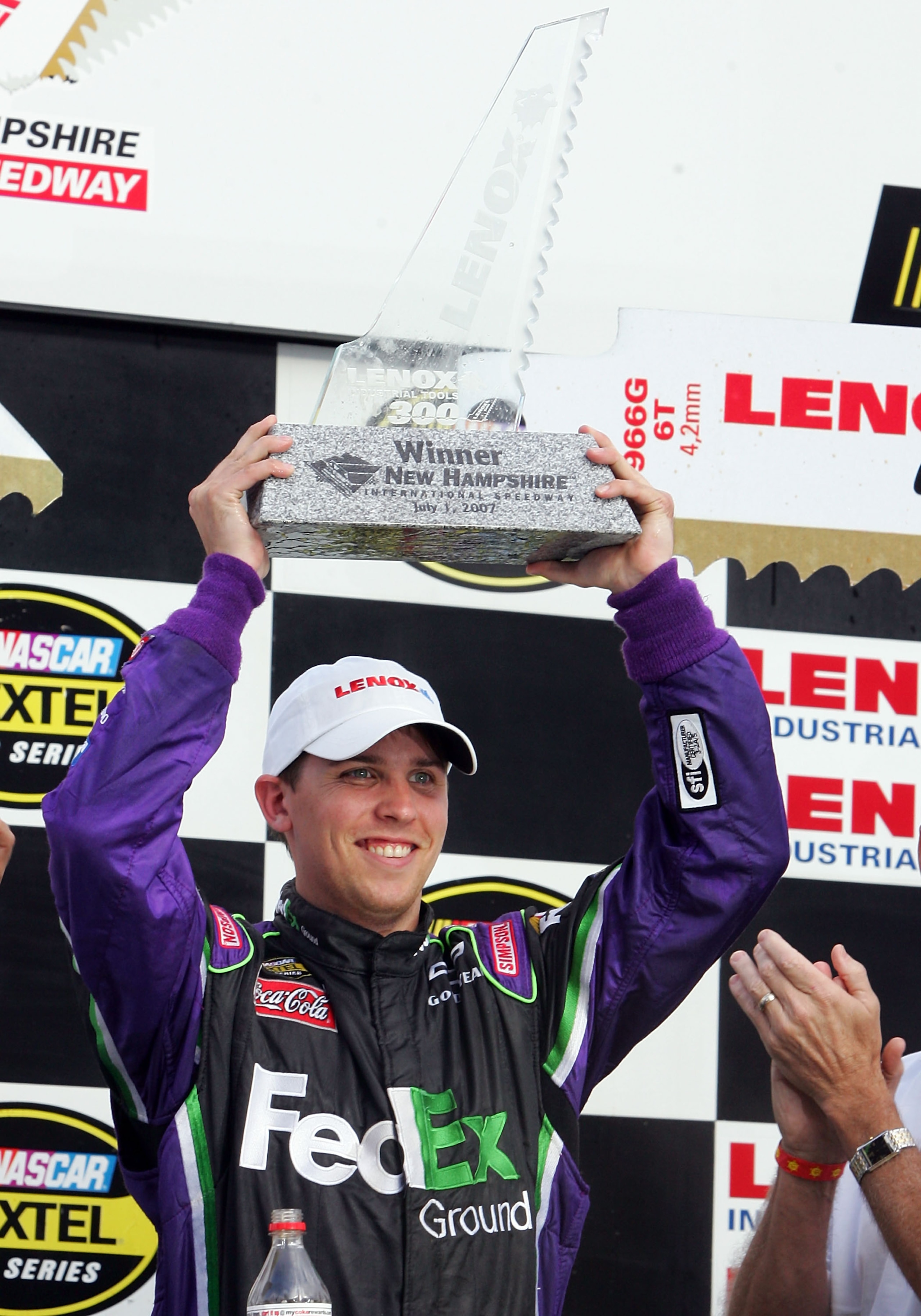 LOUDON, NH - JULY 01:  Denny Hamlin, driver of the #11 FedEx Ground Chevrolet, celebrates in victory lane after winning the NASCAR Nextel Cup Series Lenox Industrial Tools 300 at New Hampshire International Speedway on July 1, 2007 in Loudon, New Hampshir