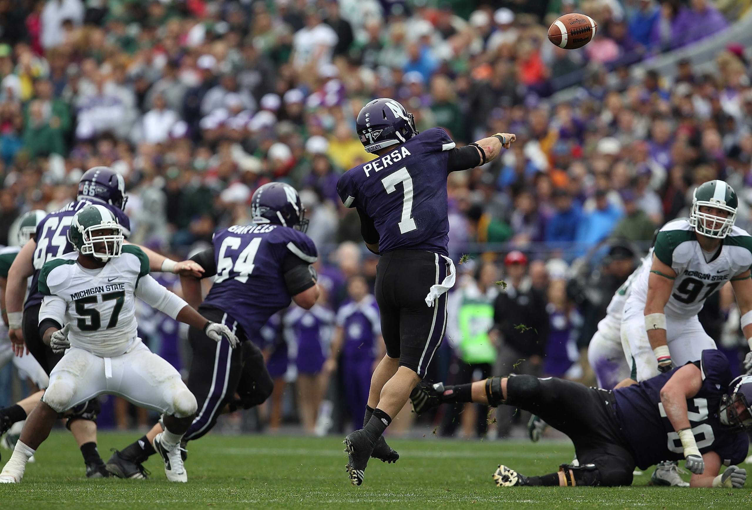 EVANSTON, IL - OCTOBER 23: Dan Persa #7 of the Northwestern Wildcats throws a pass against the Michigan State Spartans at Ryan Field on October 23, 2010 in Evanston, Illinois. Michigan State defeated Northwestern 35-27. (Photo by Jonathan Daniel/Getty Ima EVANSTON, IL - OCTOBER 23: Dan Persa #7 of the Northwestern Wildcats throws a pass against the Michigan State Spartans at Ryan Field on October 23, 2010 in Evanston, Illinois. Michigan State defeated Northwestern 35-27. (Photo by Jonathan Daniel/Getty Ima