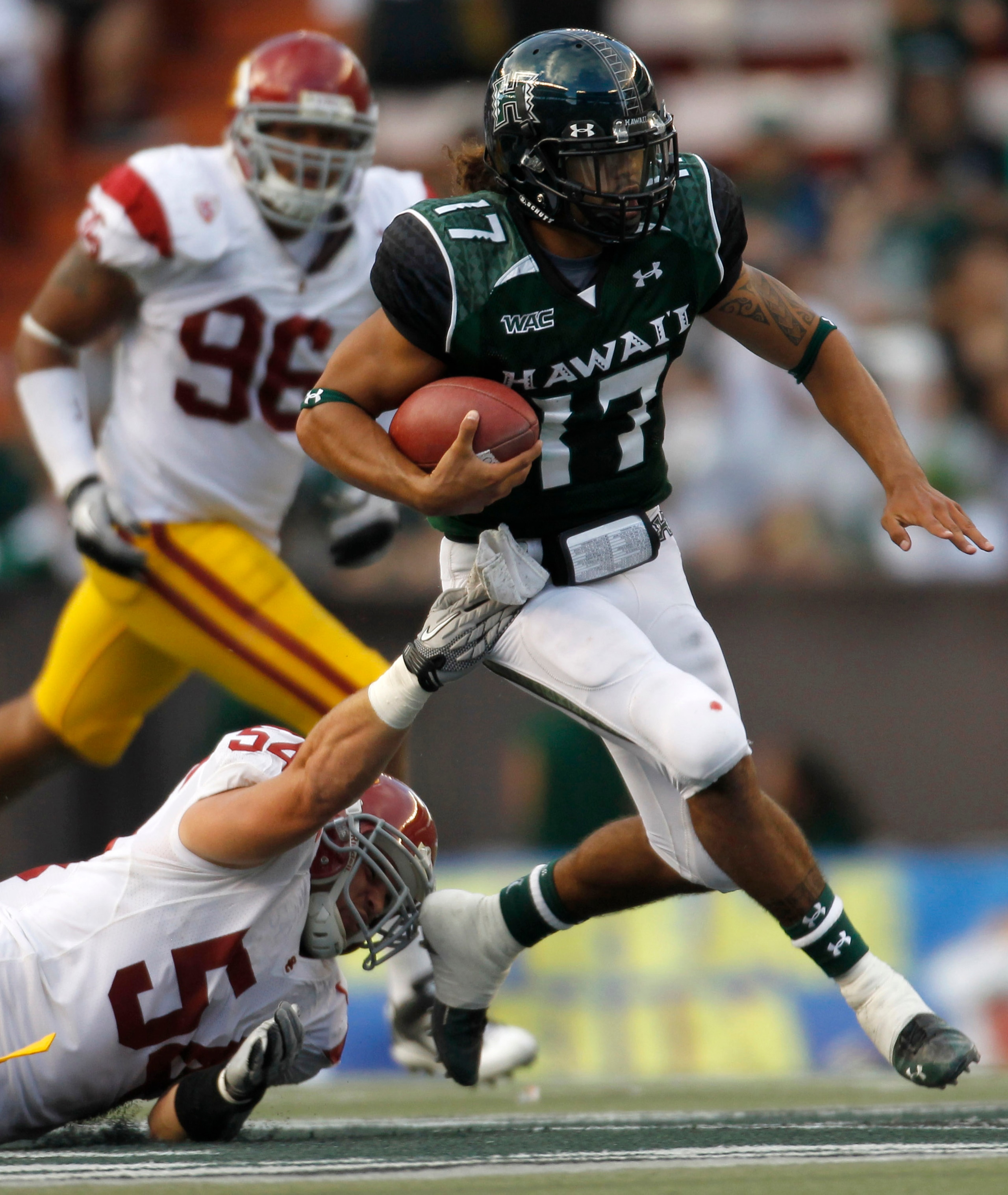 HONOLULU - SEPTEMBER 02: Bryant Moniz #17 of the University of Hawaii Warriors carries the ball during first half action against the University of Southern California Trojans at Aloha Stadium September 2, 2010 in Honolulu, Hawaii. (Photo by Kent Nishimura HONOLULU - SEPTEMBER 02: Bryant Moniz #17 of the University of Hawaii Warriors carries the ball during first half action against the University of Southern California Trojans at Aloha Stadium September 2, 2010 in Honolulu, Hawaii. (Photo by Kent Nishimura
