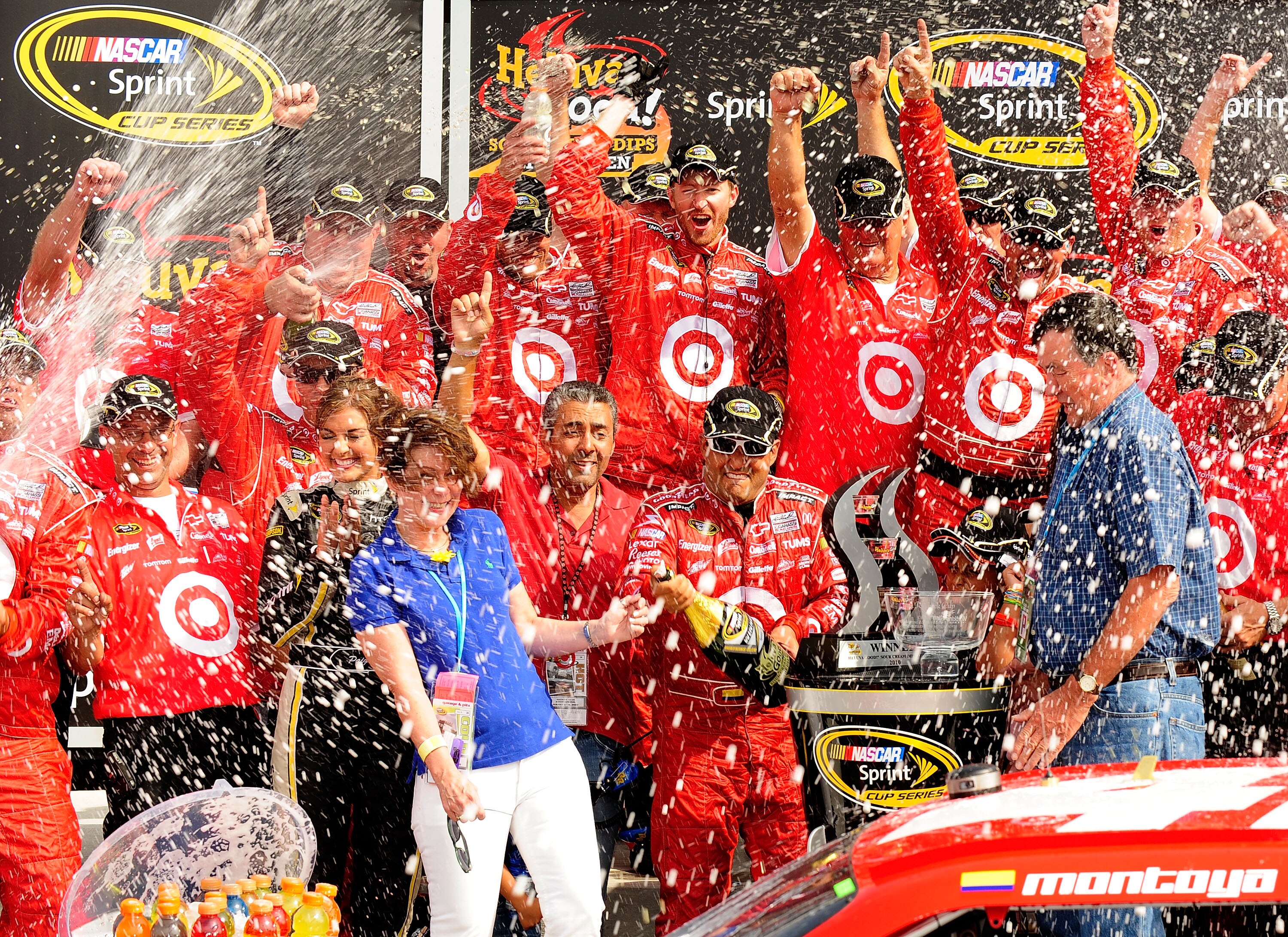 WATKINS GLEN, NY - AUGUST 08:  Juan Pablo Montoya (L), driver of the #42 Target Chevrolet, celebrates with his team after winning the NASCAR Sprint Cup Series Heluva Good! Sour Cream Dips at Watkins Glen International on August 8, 2010 in Watkins Glen, Ne