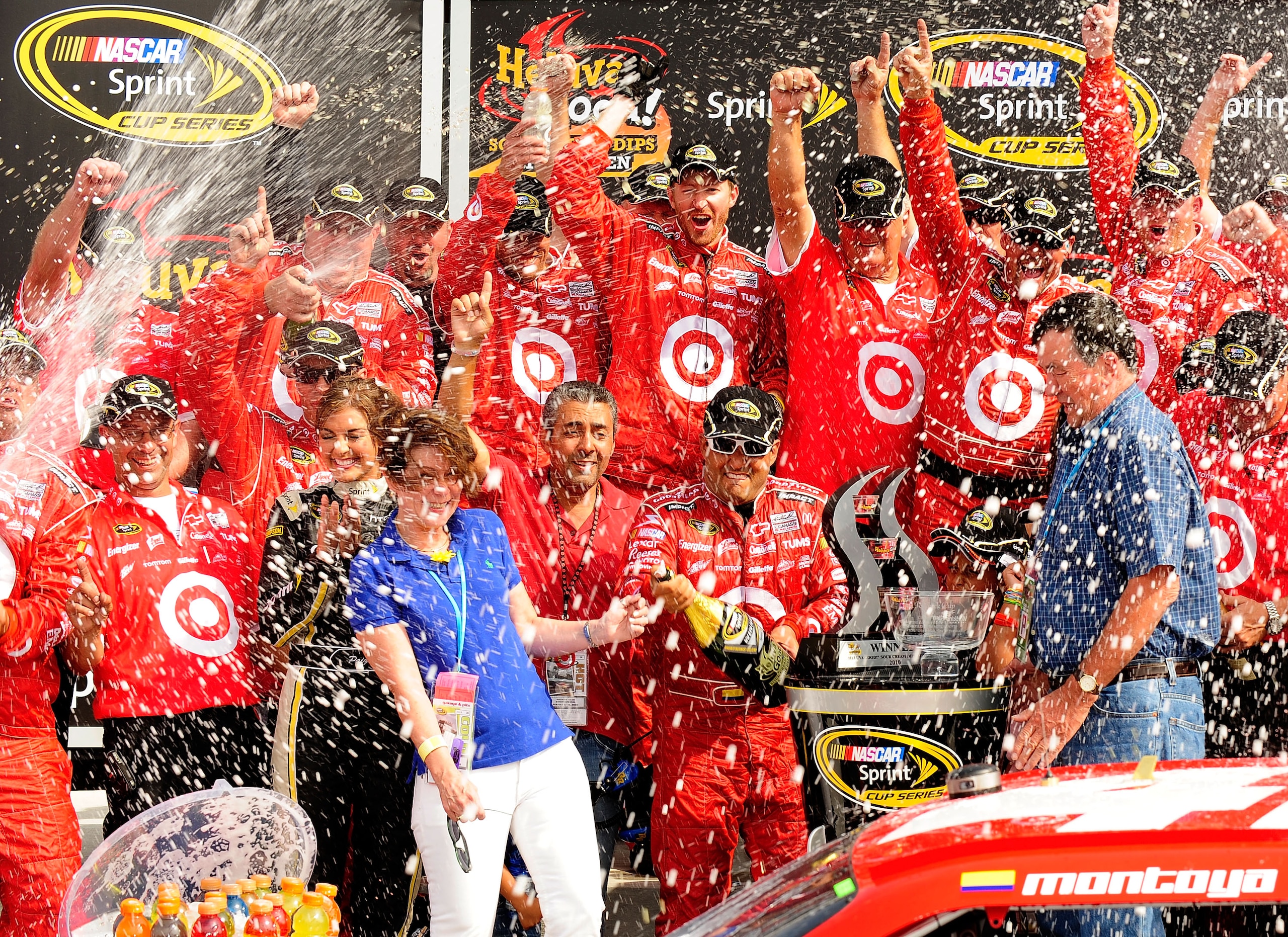 WATKINS GLEN, NY - AUGUST 08:  Juan Pablo Montoya (L), driver of the #42 Target Chevrolet, celebrates with his team after winning the NASCAR Sprint Cup Series Heluva Good! Sour Cream Dips at Watkins Glen International on August 8, 2010 in Watkins Glen, Ne