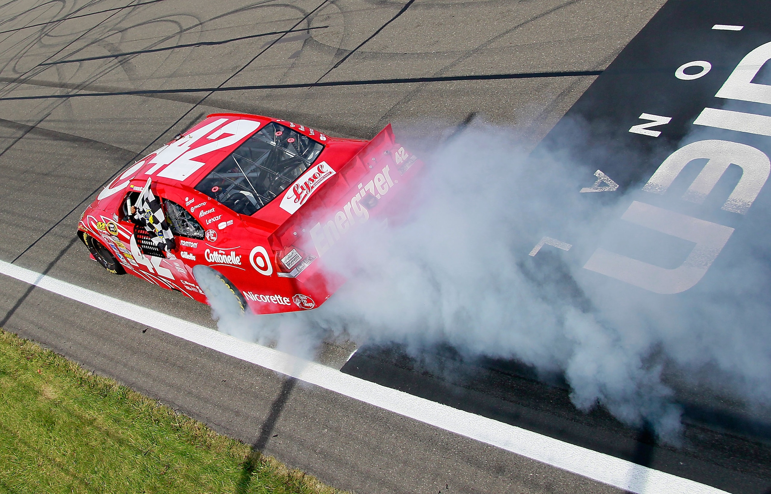 WATKINS GLEN, NY - AUGUST 08:  Juan Pablo Montoya, driver of the #42 Target Chevrolet, performs a burnout after winning the NASCAR Sprint Cup Series Heluva Good! Sour Cream Dips at Watkins Glen International on August 8, 2010 in Watkins Glen, New York.  (