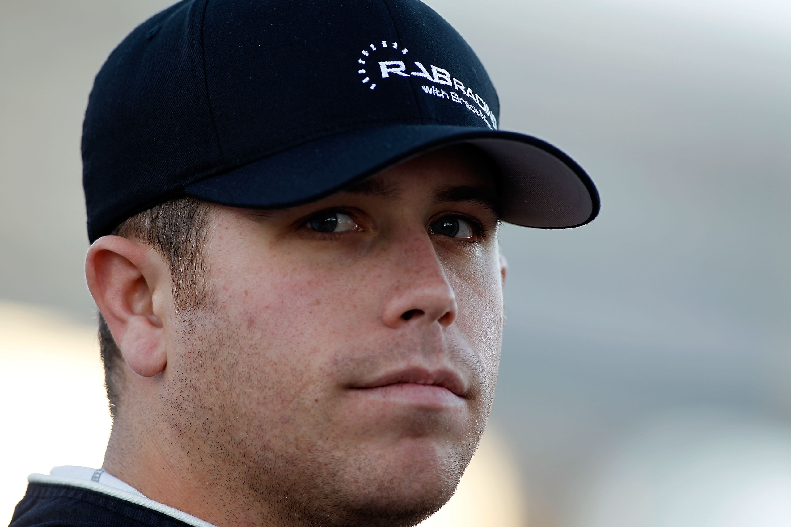 FORT WORTH, TX - NOVEMBER 05:  Brian Scott, driver of the #09 Shore Lodge Toyota, stands on the grid during qualifying for the NASCAR Nationwide Series O'Reilly Auto Parts Challenge at Texas Motor Speedway on November 5, 2010 in Fort Worth, Texas.  (Photo